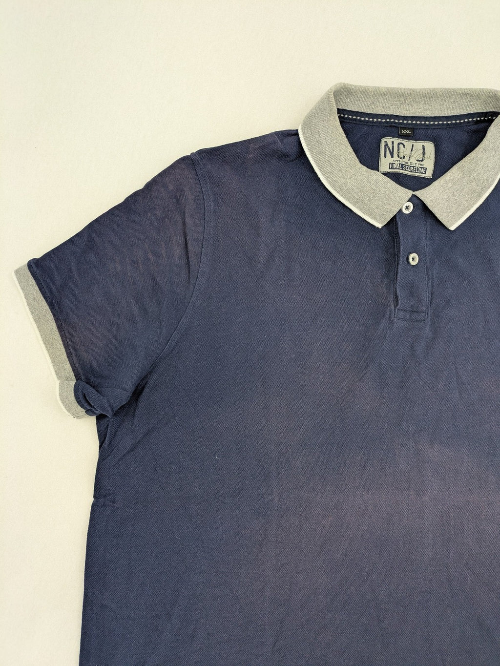 XXL navy polo shirt with grey contrast collar and cuffs, 100% cotton material.