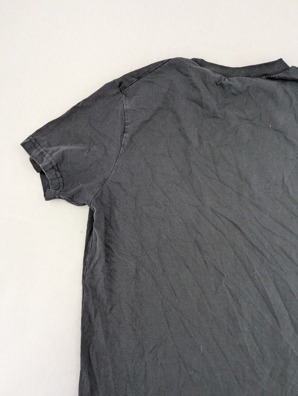 Dsquared2 grey short sleeve shirt with red maple leaf and smiley face graphic.