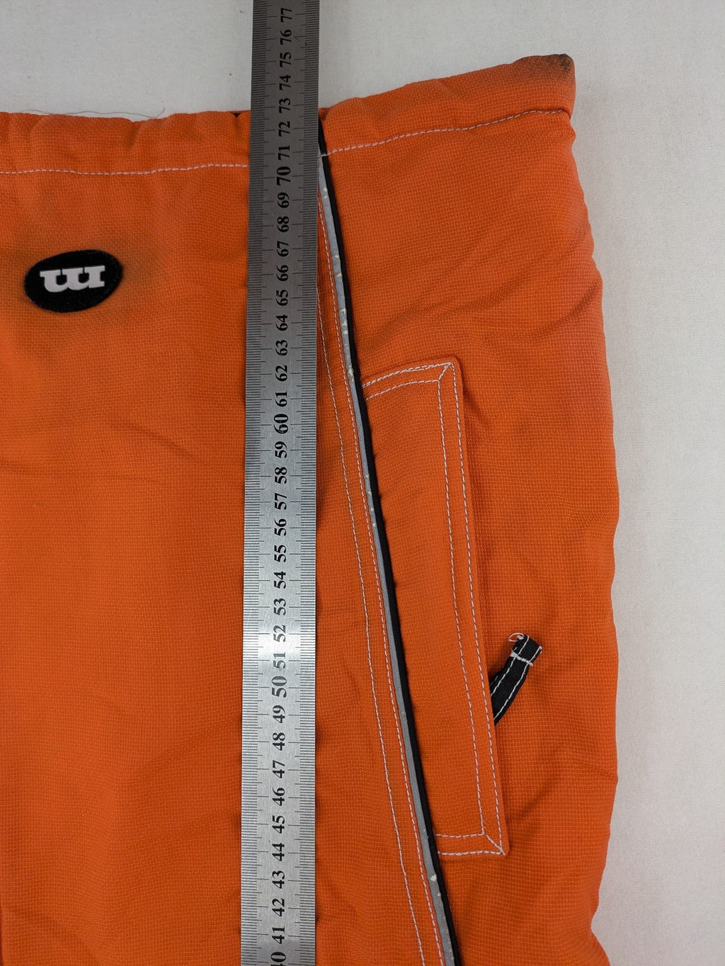 Outback orange outdoor jacket size 42 with reflective accents and mixed color details.