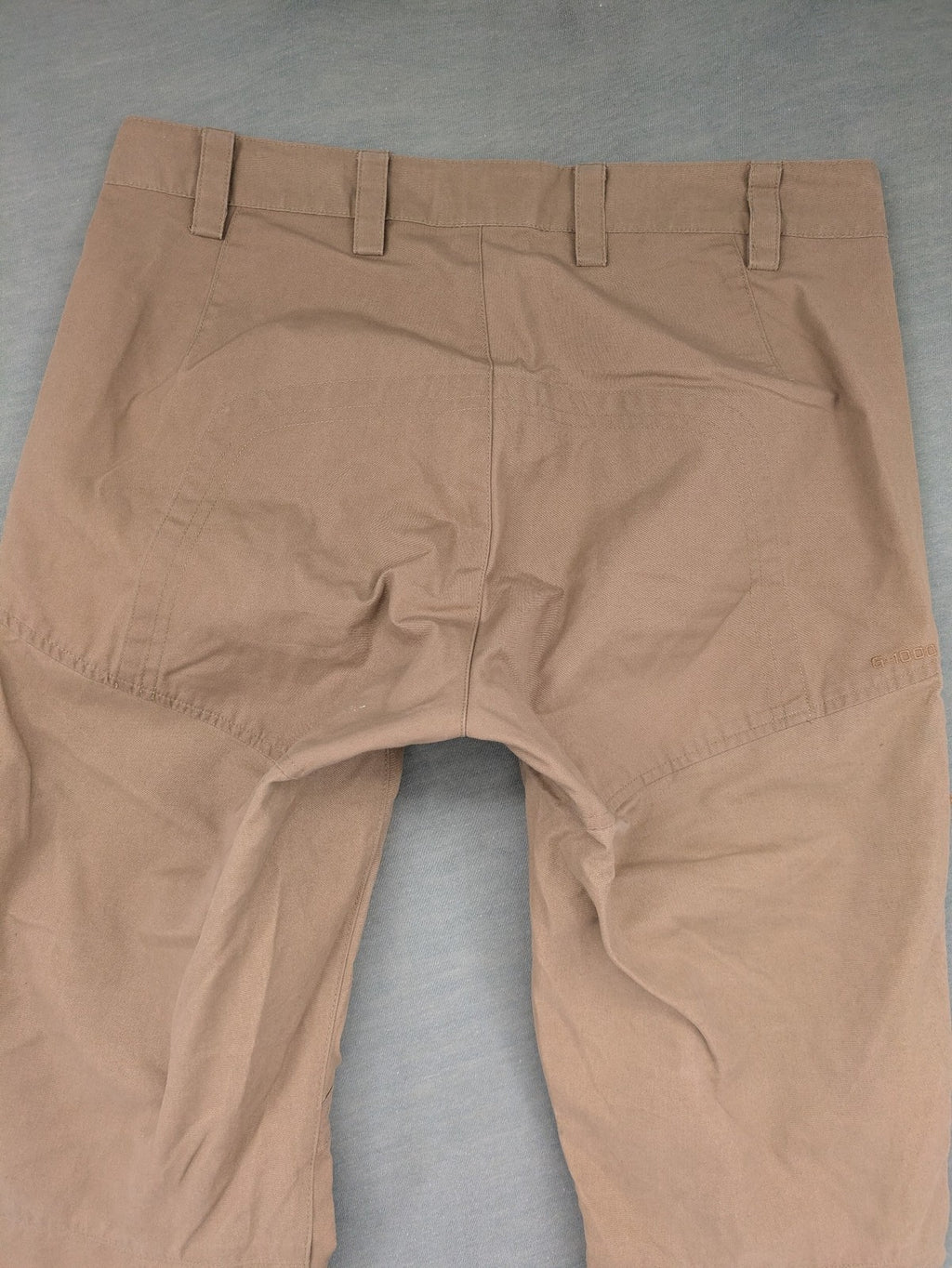 Fjällräven beige pants regular fit durable fabric outdoor style with logo detail.