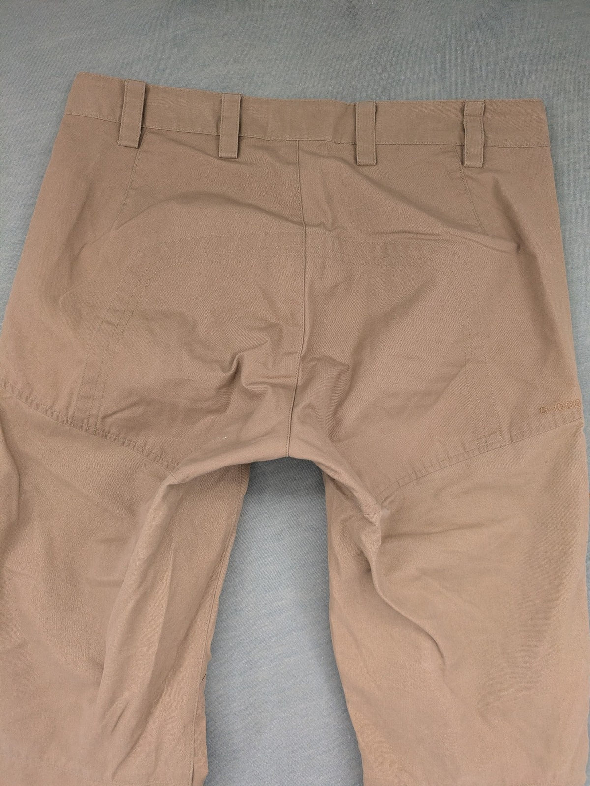 Fjällräven beige pants regular fit durable fabric outdoor style with logo detail.