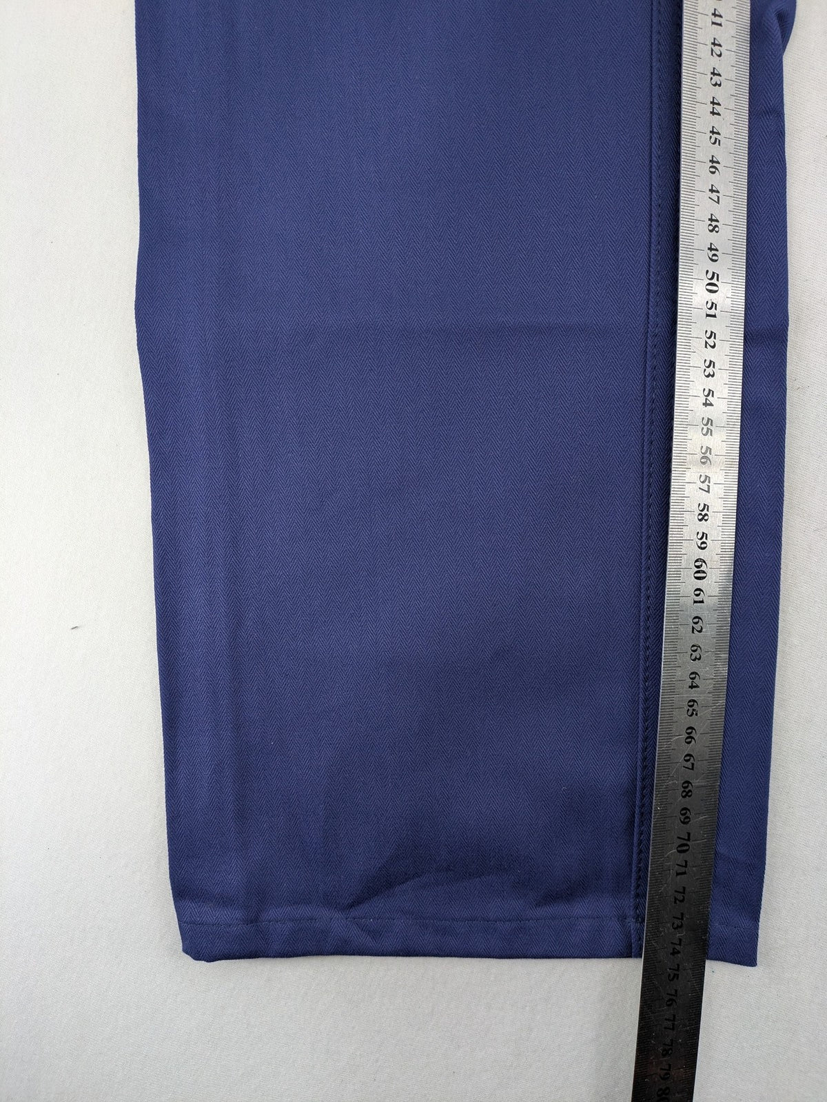 Uvex navy work trousers 100% cotton with button closure and belt loops.
