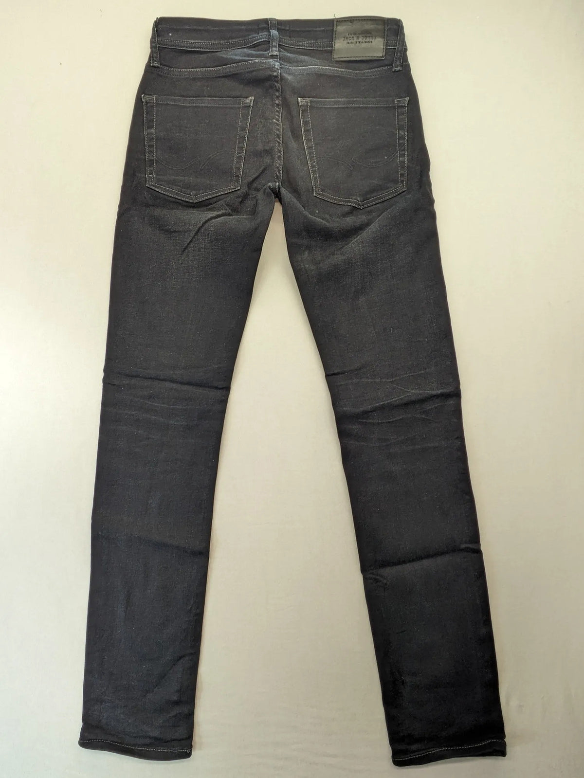 Jack & Jones grey slim fit jeans with classic 5-pocket style and button closure.