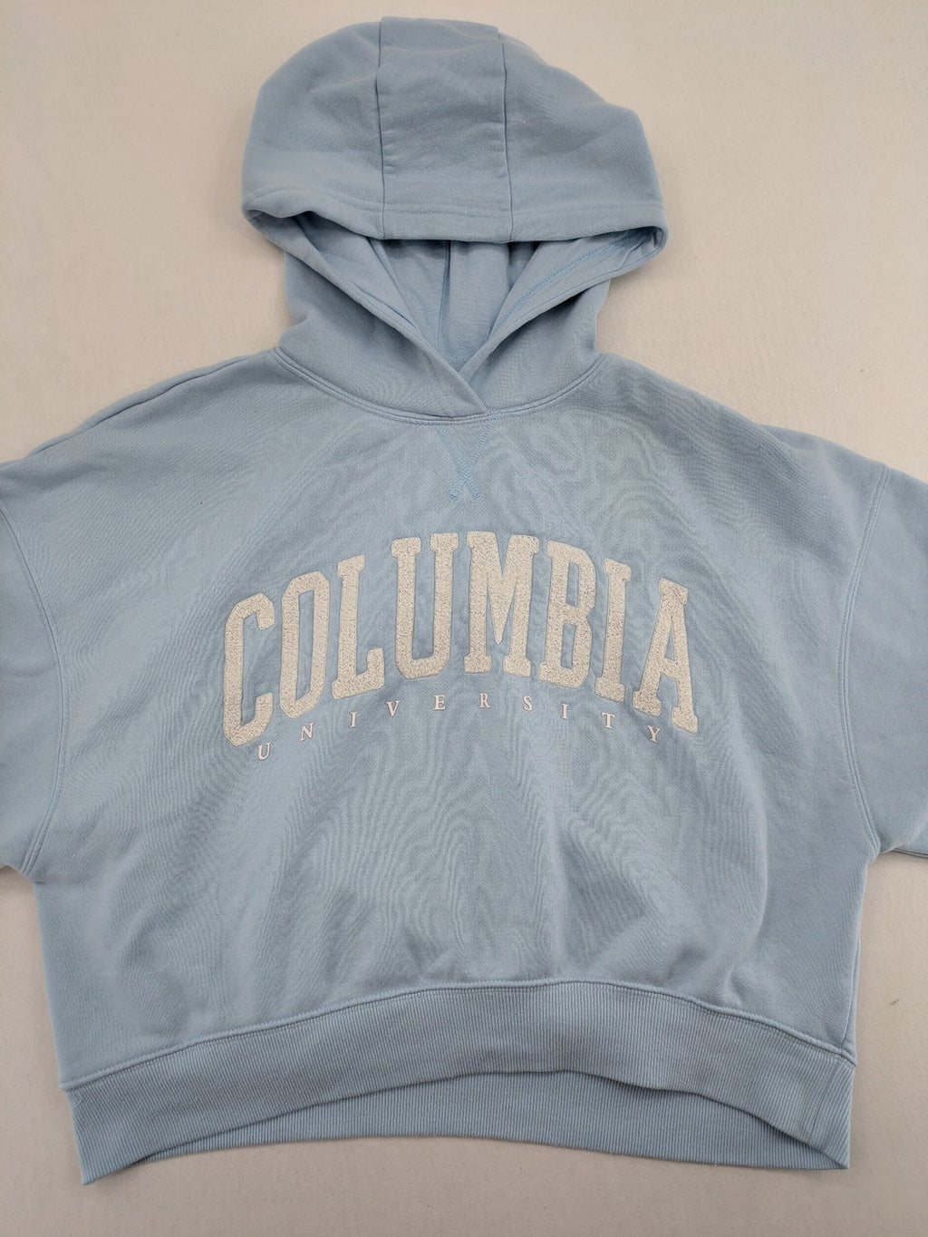 Columbia University blue hoodie with large "Columbia University" text on chest.
