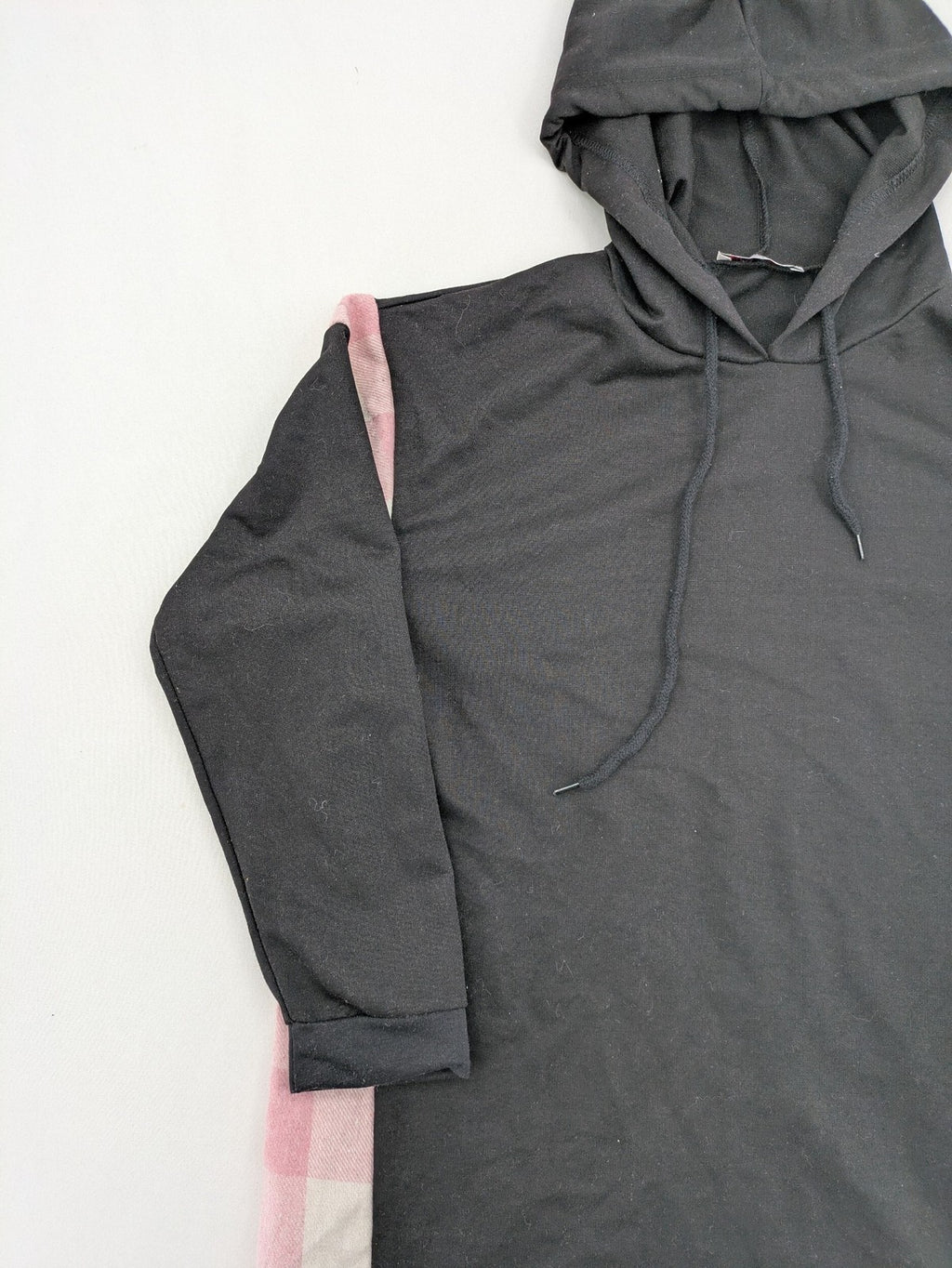 L'ange pink hoodie dress with black body and contrasting pink-white checkered panels.