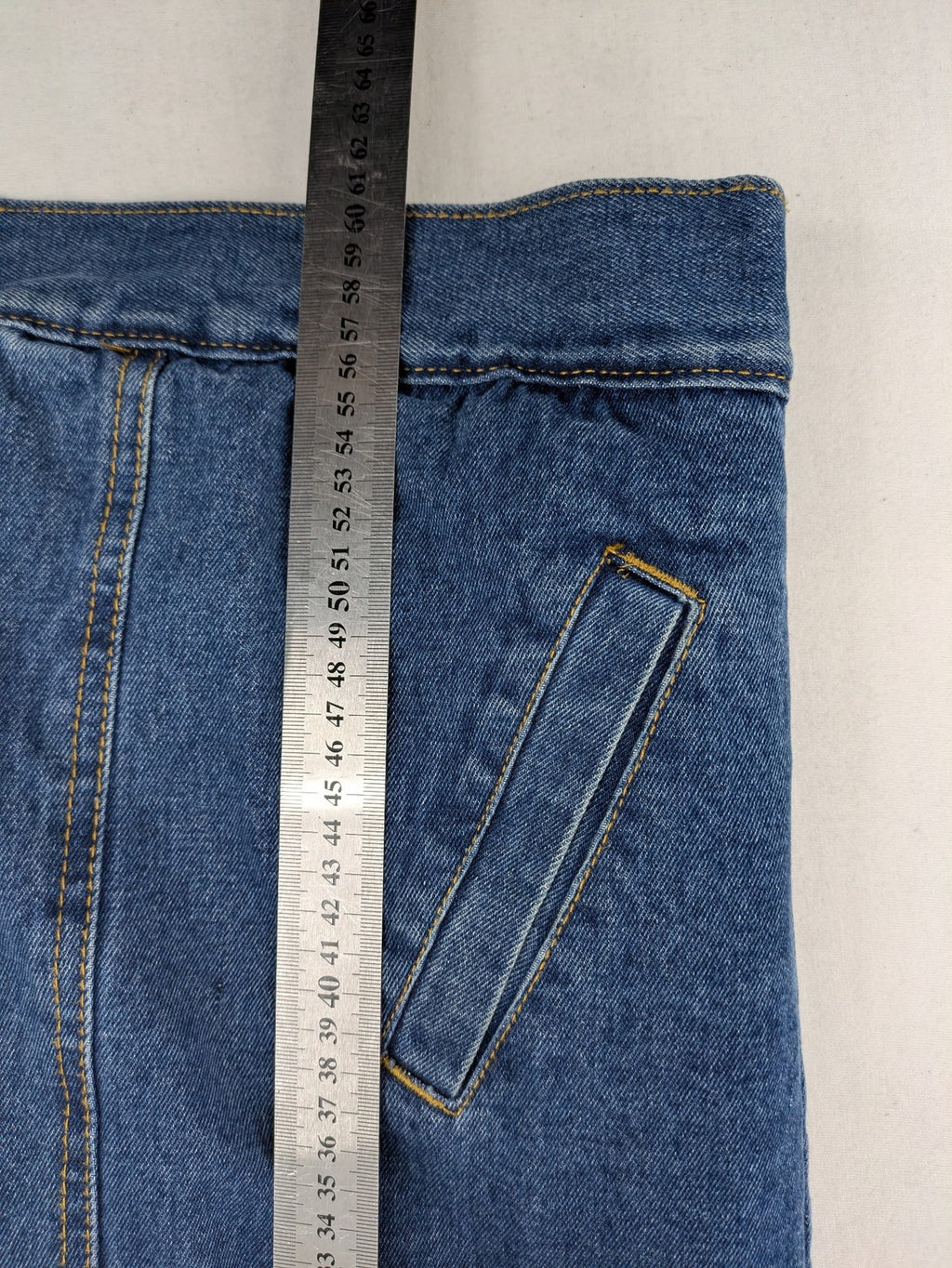 Denim & Co. blue jacket with cream Sherpa lining, button closure, and pockets.