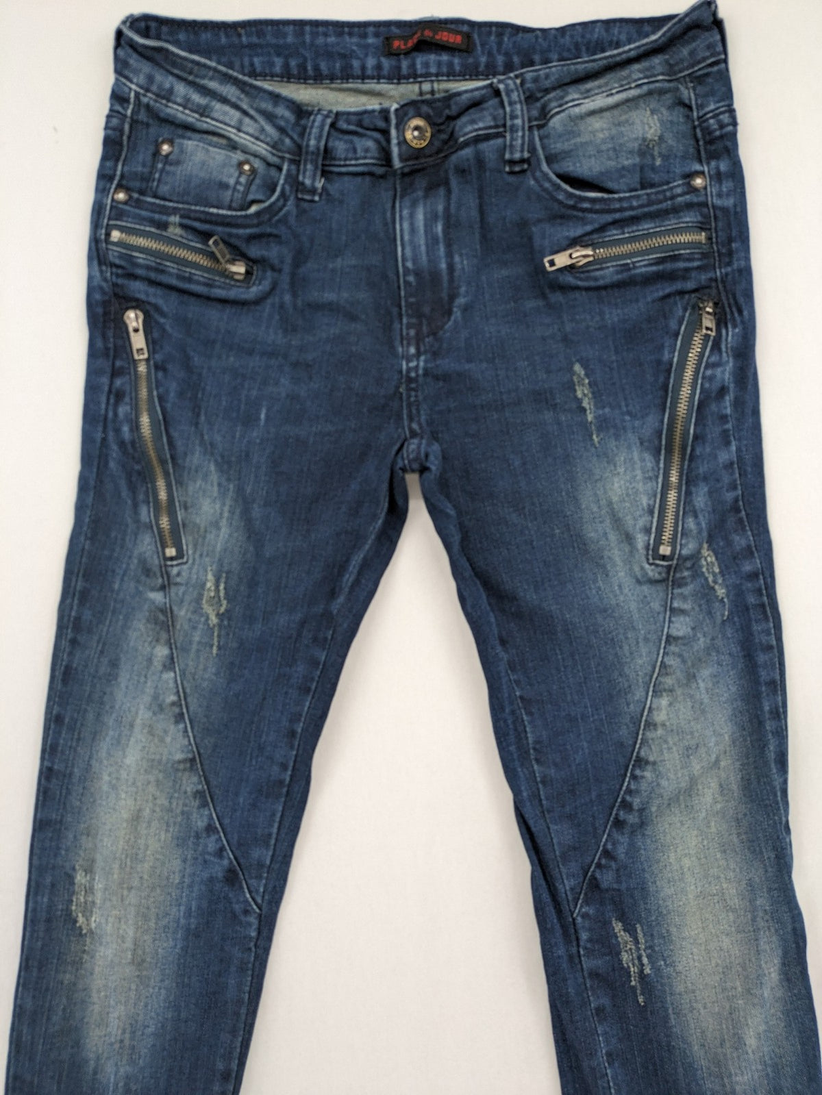 Place du Jour blue biker jeans with zippers, used-look wash, and star rivet detail.