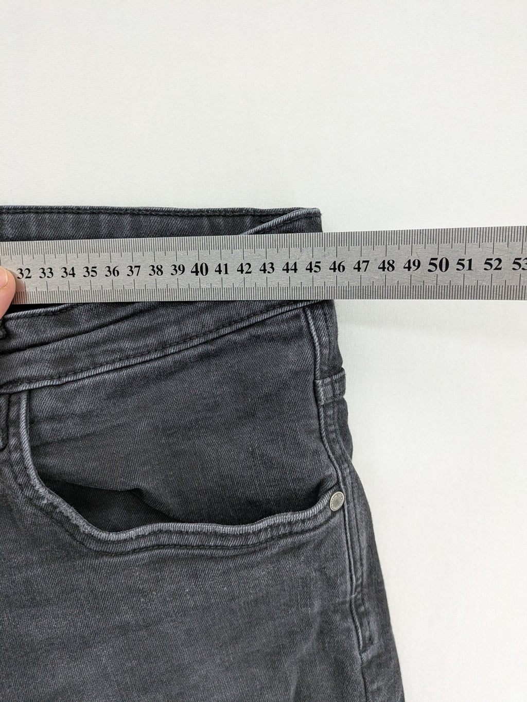 Denim 1982 grey slim fit jeans with ripped knee detail and distressed finish.