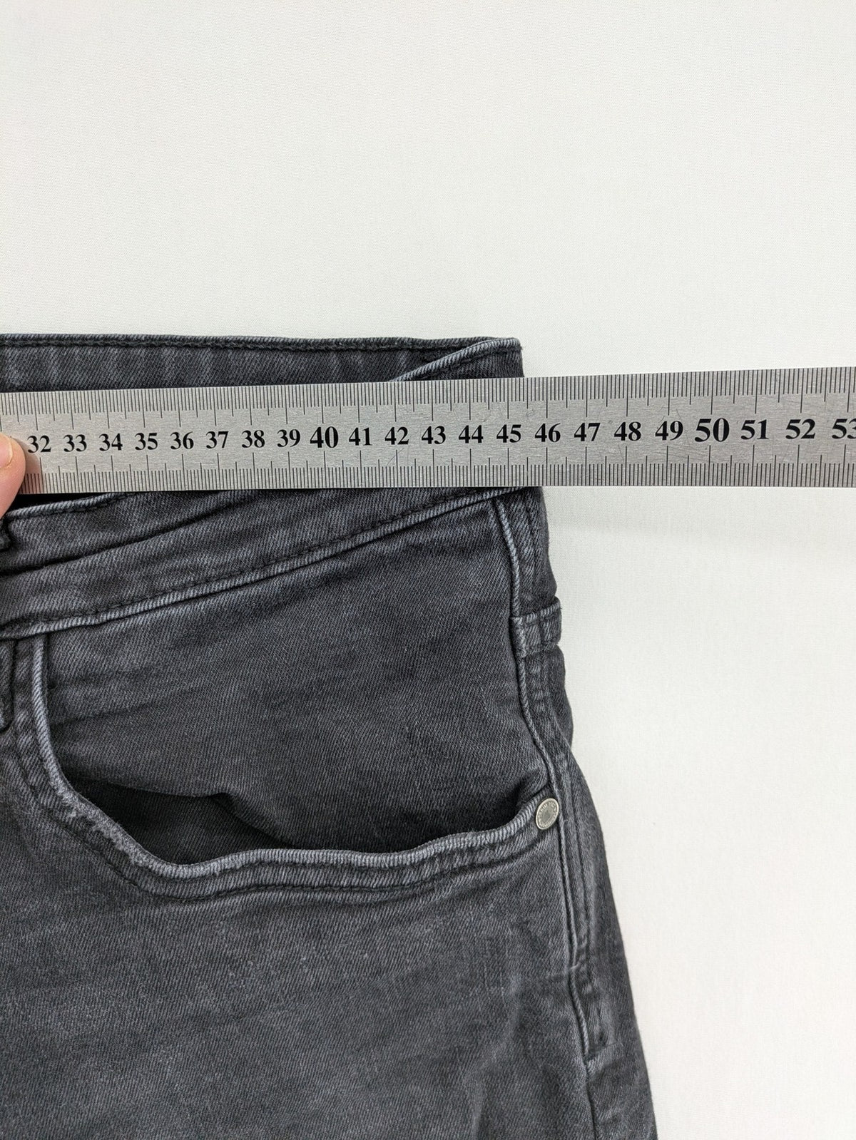 Denim 1982 grey slim fit jeans with ripped knee detail and distressed finish.