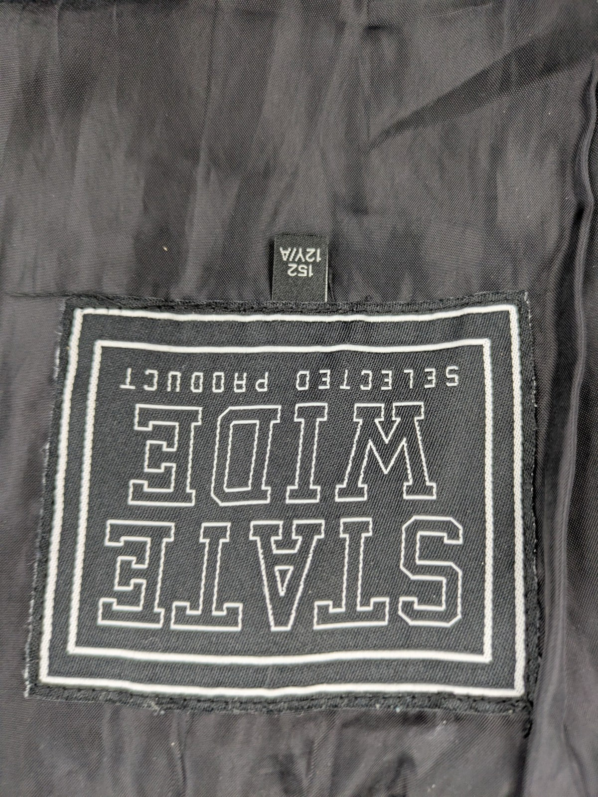 C&A black puffer jacket with NYC83 graphic, hood, and multiple pockets.