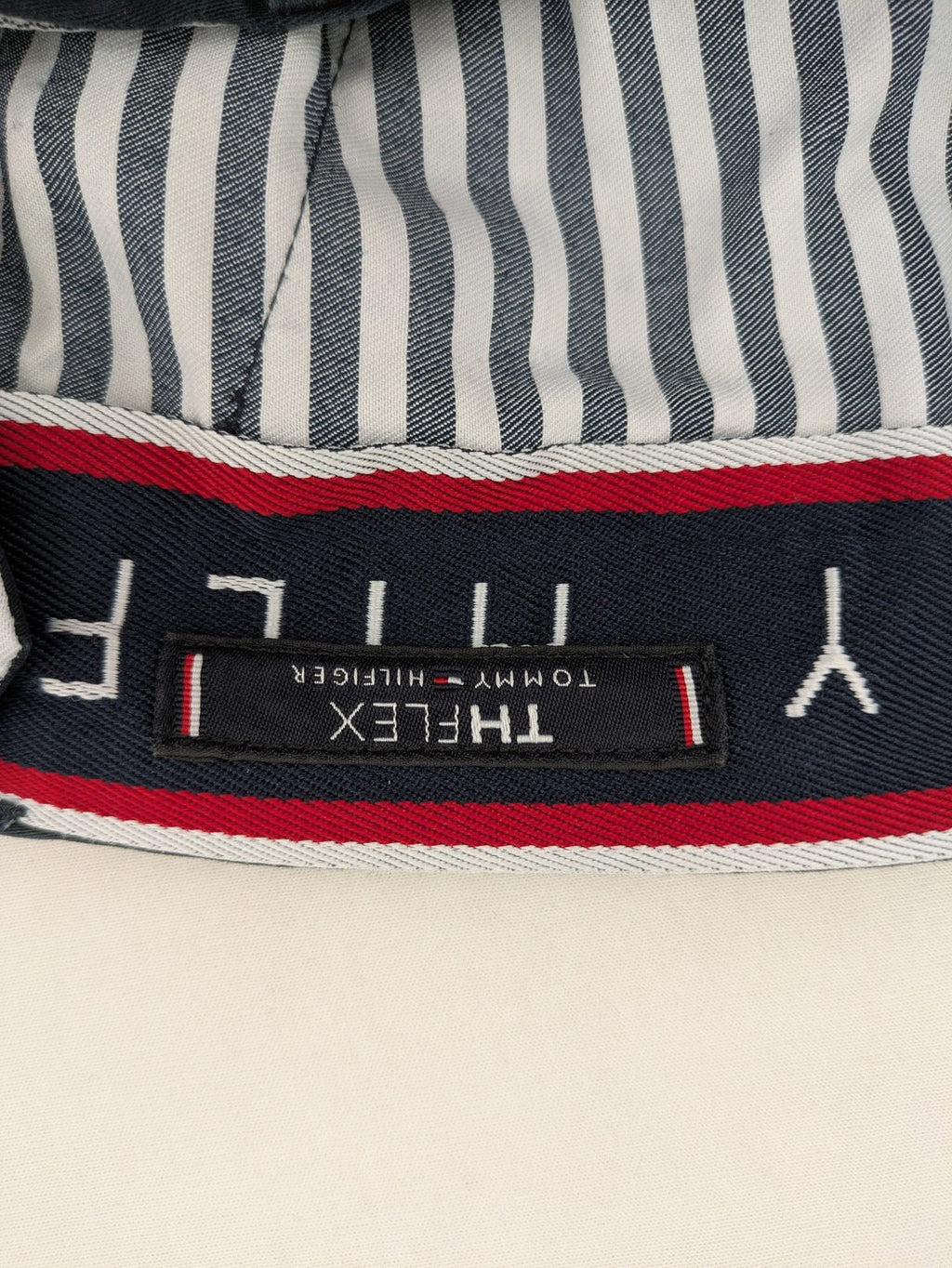 Tommy Hilfiger grey chino pants with TH-Flex stretch technology and classic straight fit design.