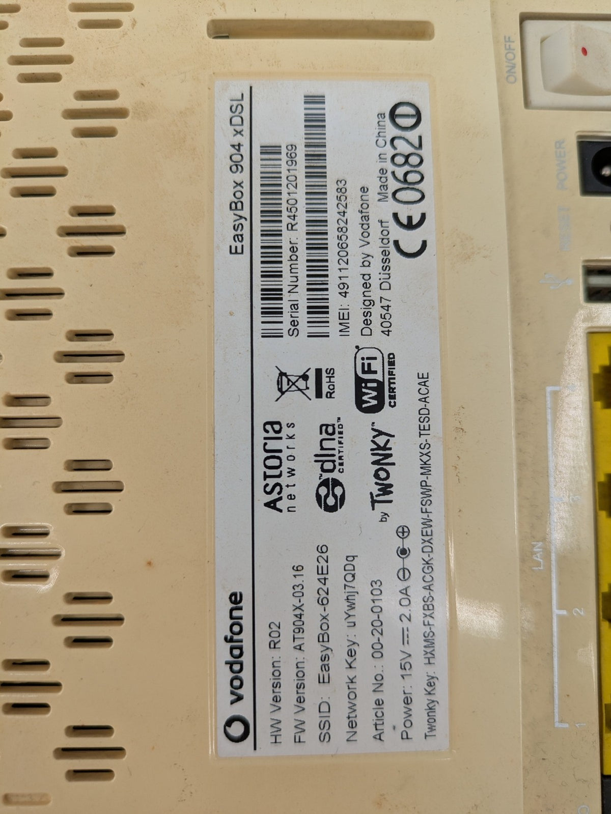 Vodafone beige wireless router with multiple LAN ports and DSL connectivity.