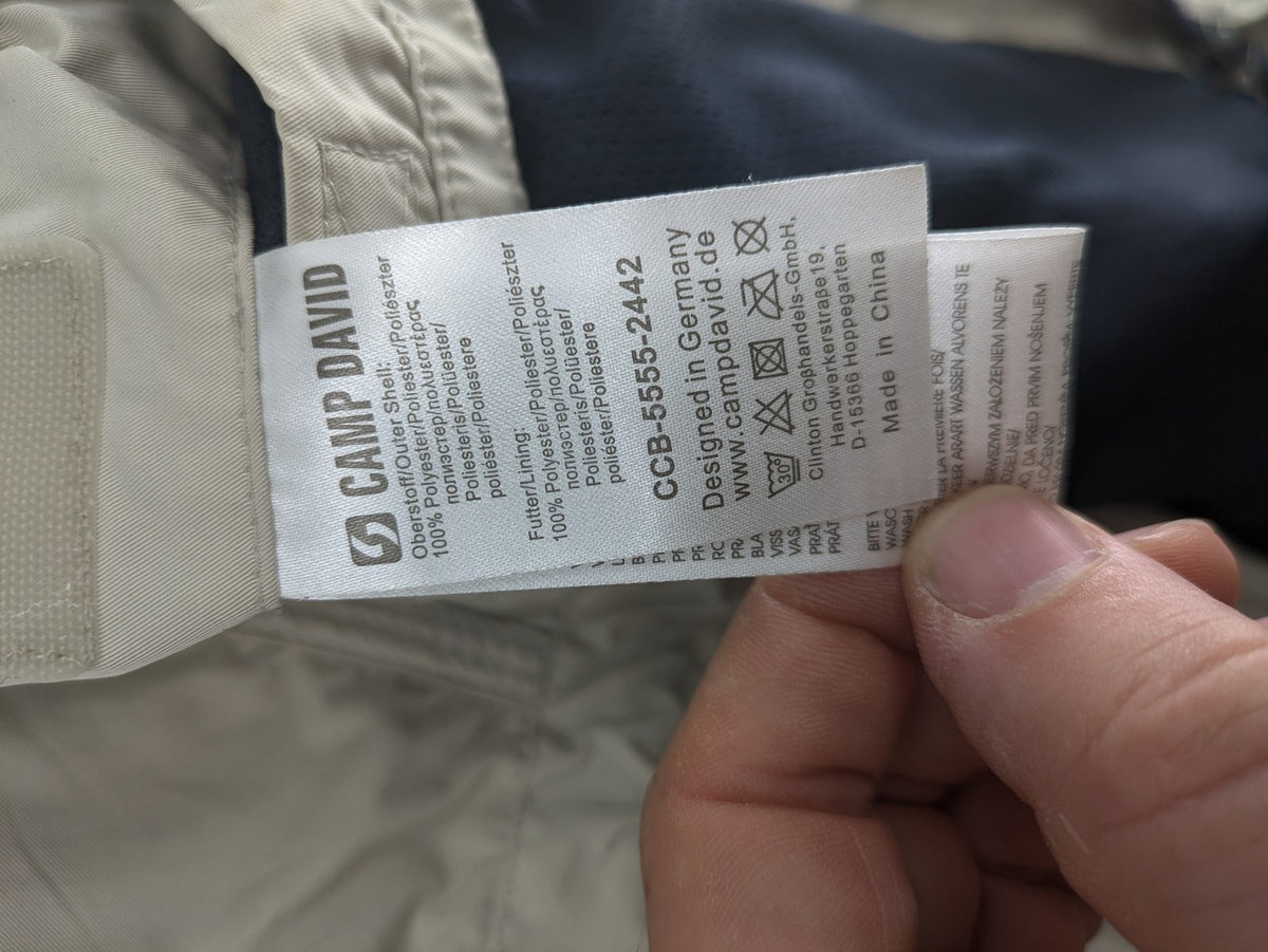 Camp David beige field jacket with logo patches, standing collar, and multiple pockets.