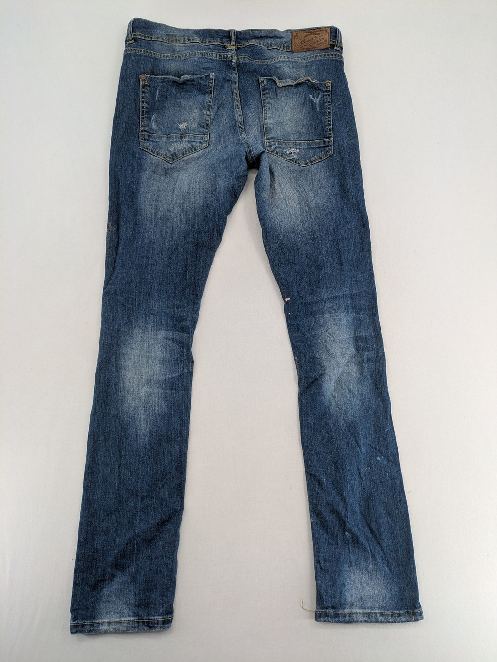 alcott skinny fit jeans blue distressed with button fly and strong wash details