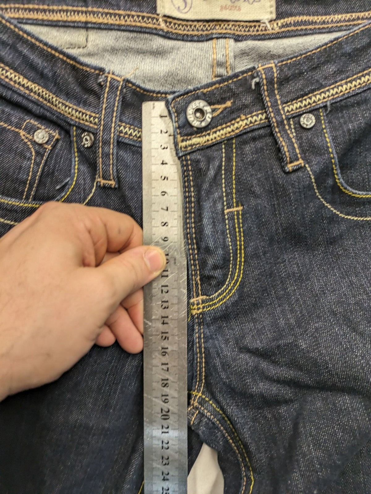 Furore blue straight jeans with yellow contrast stitching and zipper details.