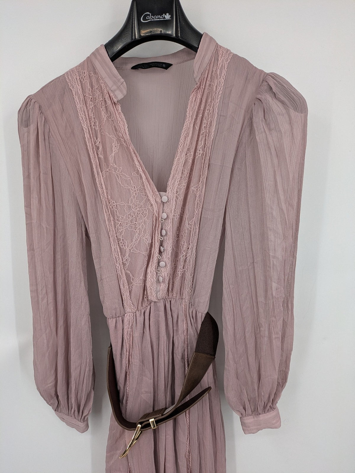 Zara pink midi dress with lace V-neck, pleated fabric, and long bishop sleeves.