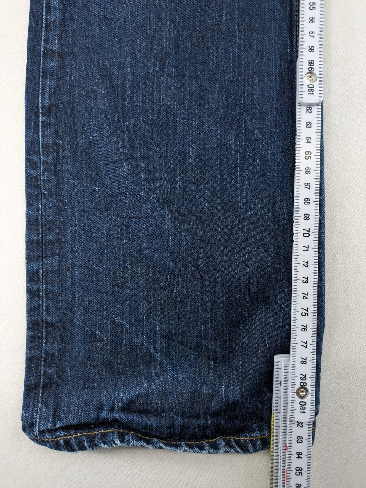 W32 blue straight jeans with classic 5-pocket design and dark wash denim.