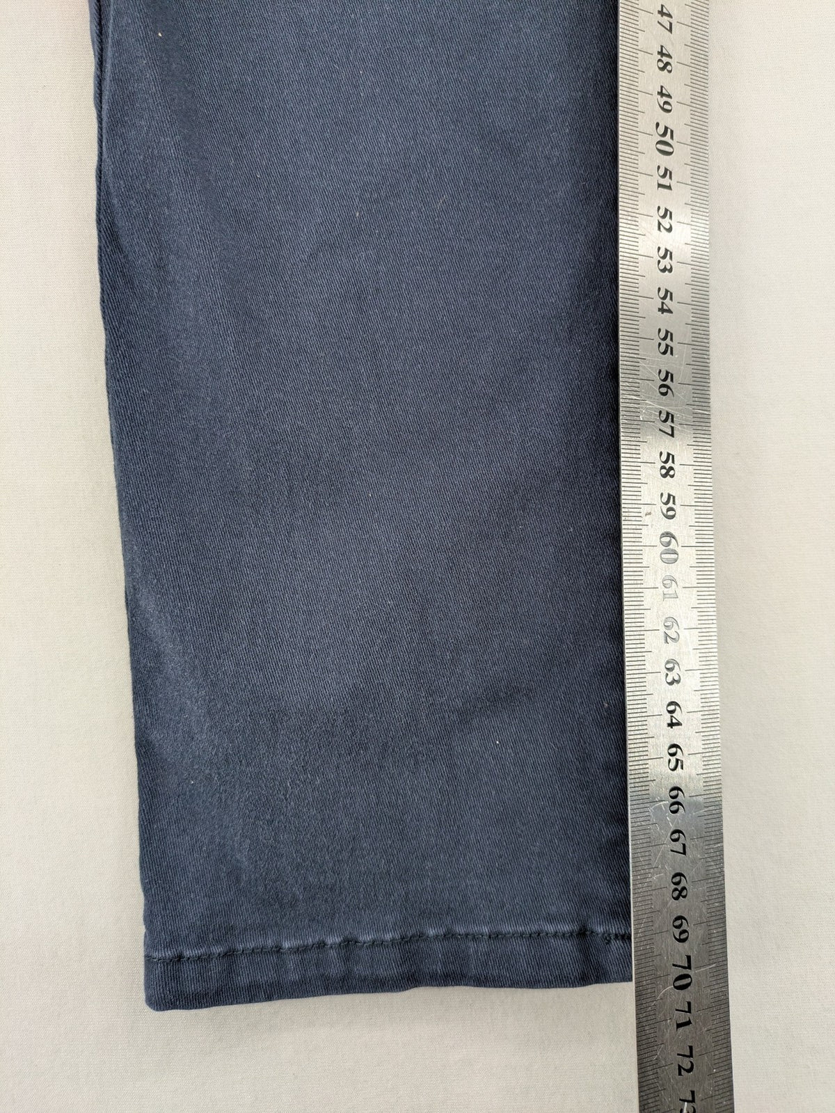 H&M navy chino pants with stretch, classic design, soft cotton blend material.