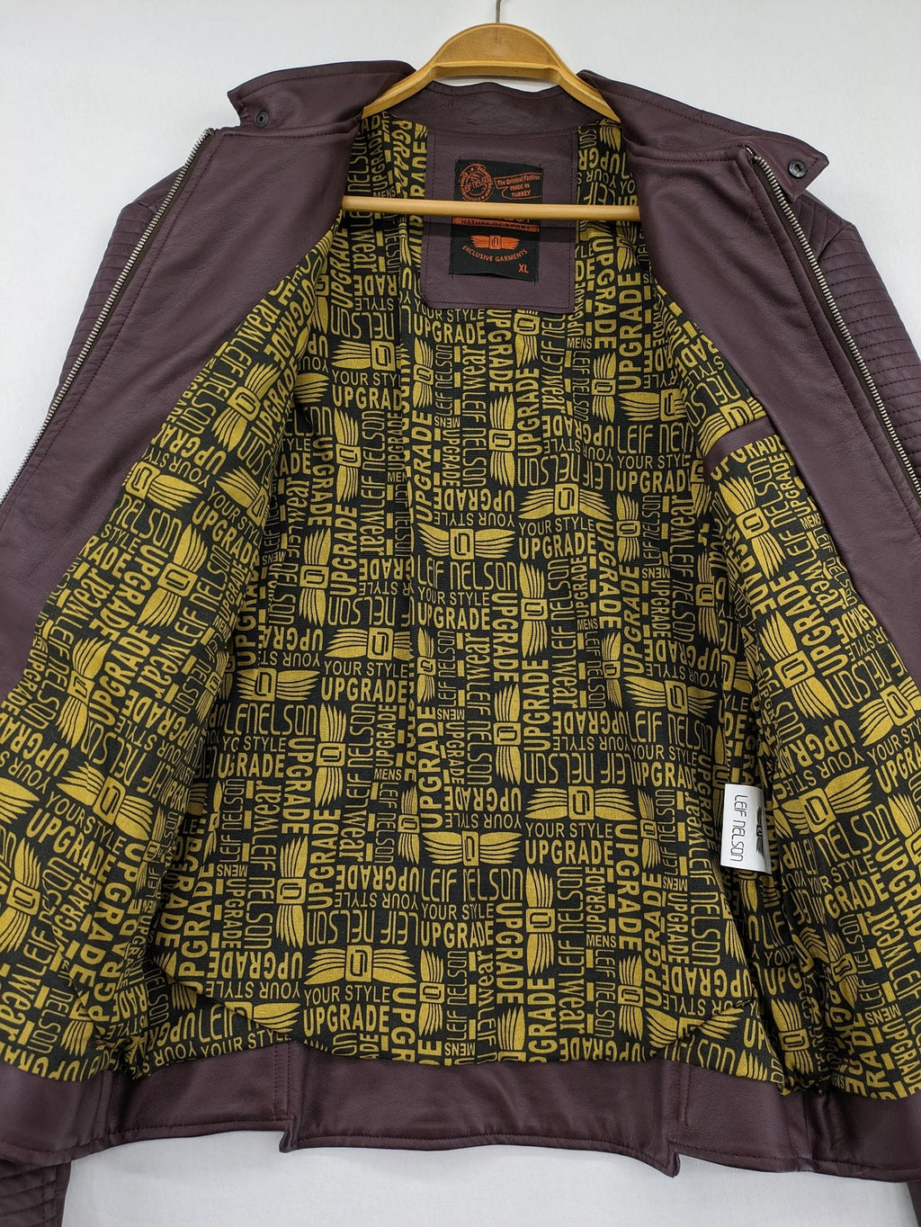Leif Nelson burgundy biker jacket faux leather with quilted shoulder and sleeve details.