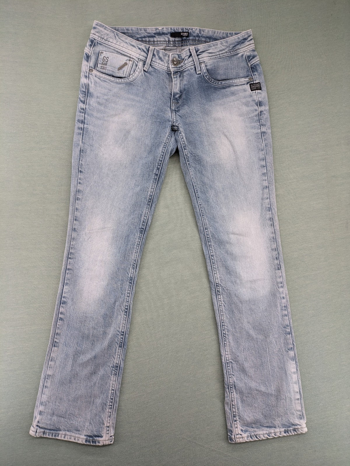 G-Star Raw blue straight leg jeans with classic 5-pocket design and light wash denim.