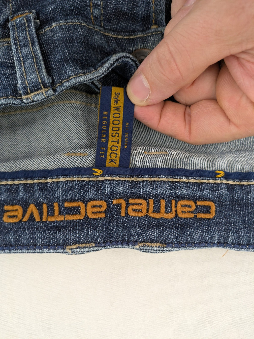 Camel Active blue straight jeans with classic 5-pocket design and logo patch.