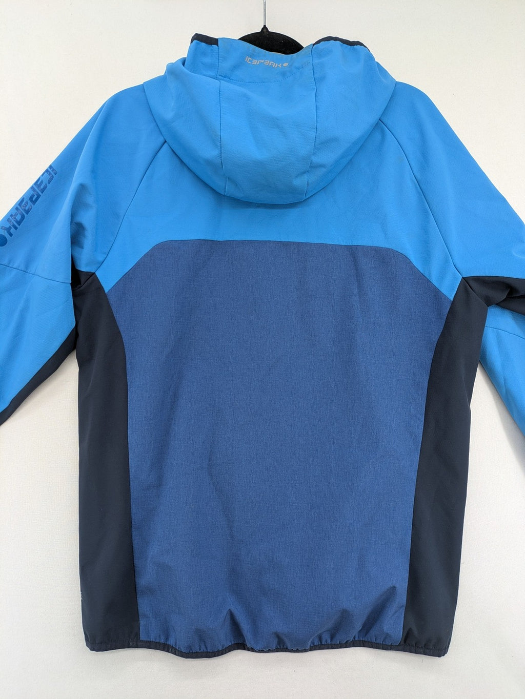 Icepeak blue softshell jacket colorblock design with zip pockets and logo details.