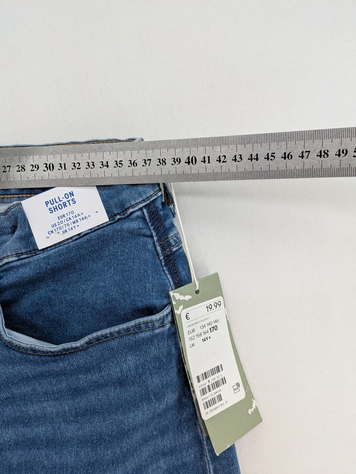 H&M blue denim shorts with adjustable drawstring, rolled hem, classic 5-pocket design.