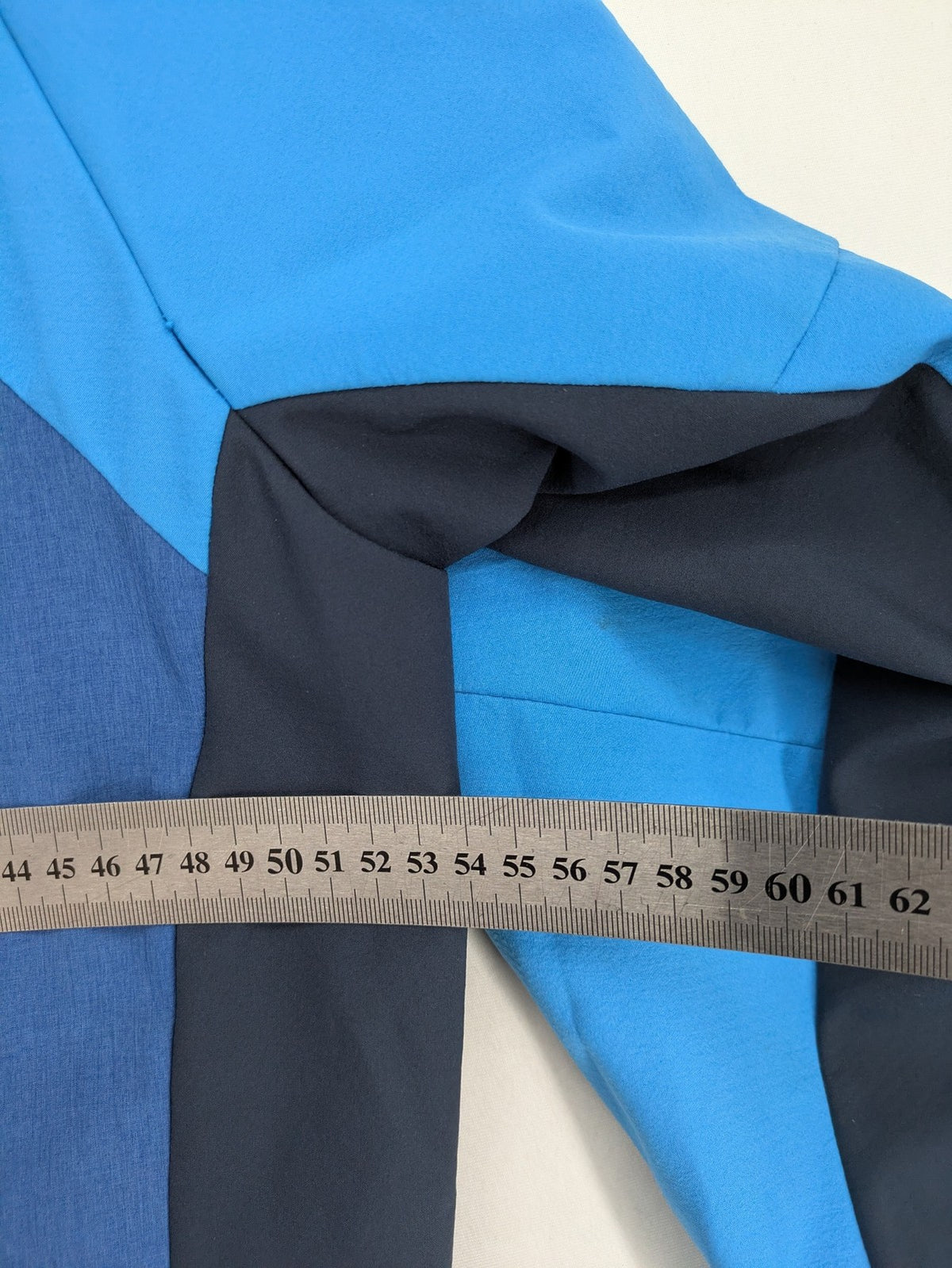Icepeak blue softshell jacket colorblock design with zip pockets and logo details.