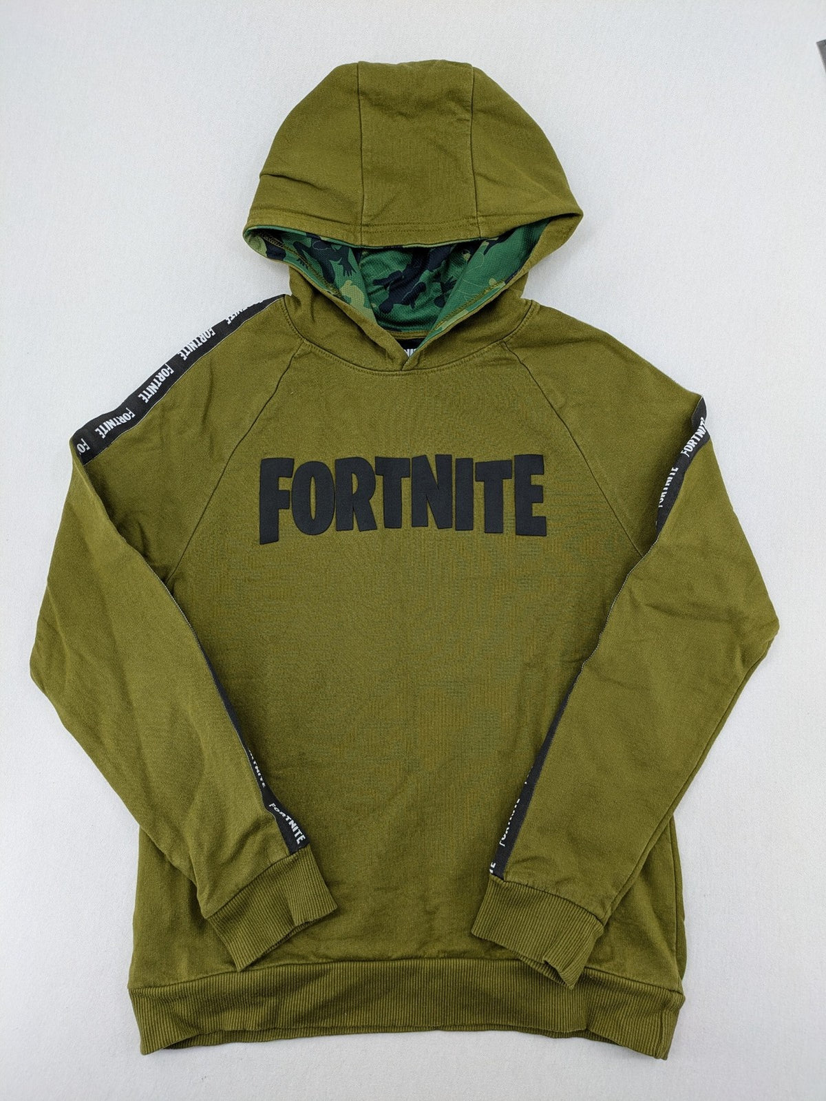 Fortnite green camo hoodie with black logo, contrasting hood, and logo taping on sleeves.