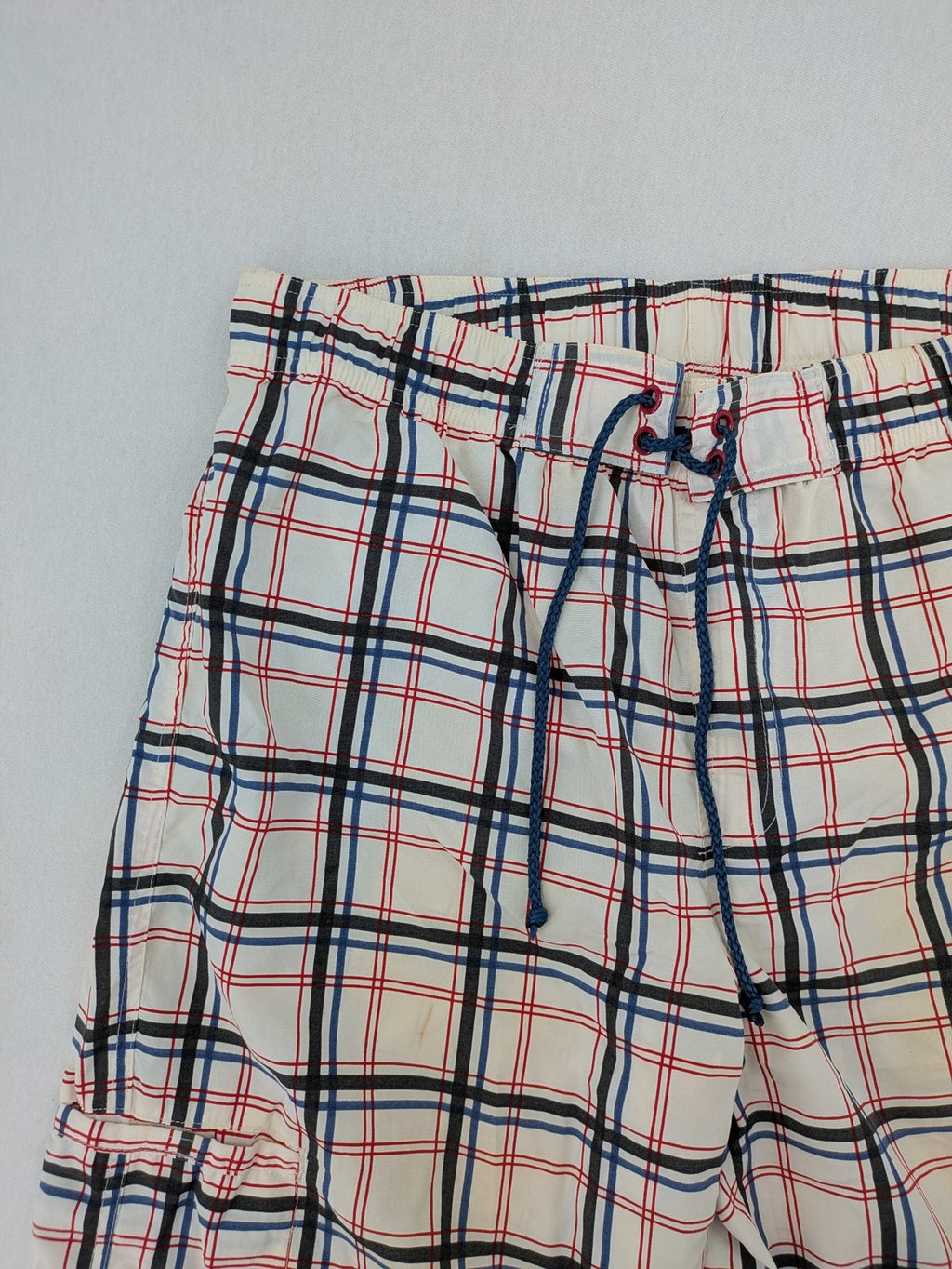 Crivit multi-coloured board shorts with classic check pattern and adjustable drawstring waistband.