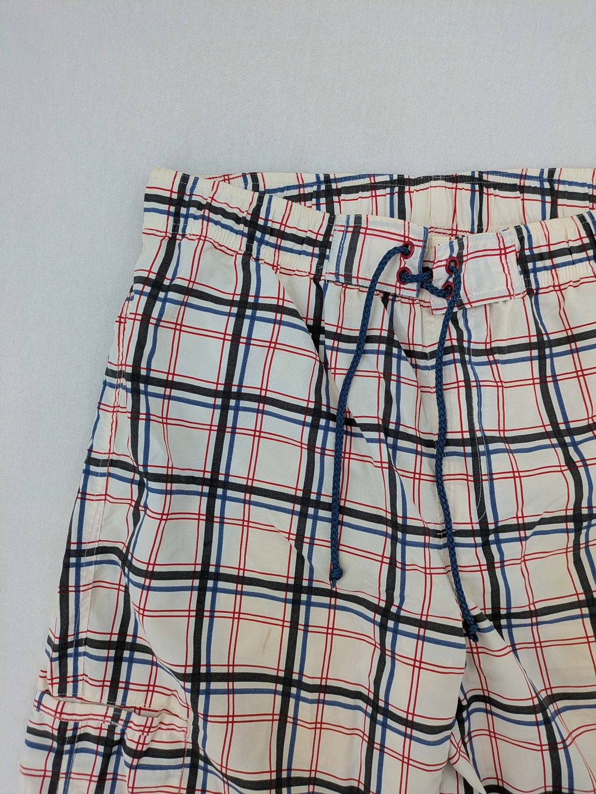 Crivit multi-coloured board shorts with classic check pattern and adjustable drawstring waistband.