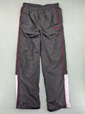 Fila grey jogging pants with red piping and embroidered logo on thigh.