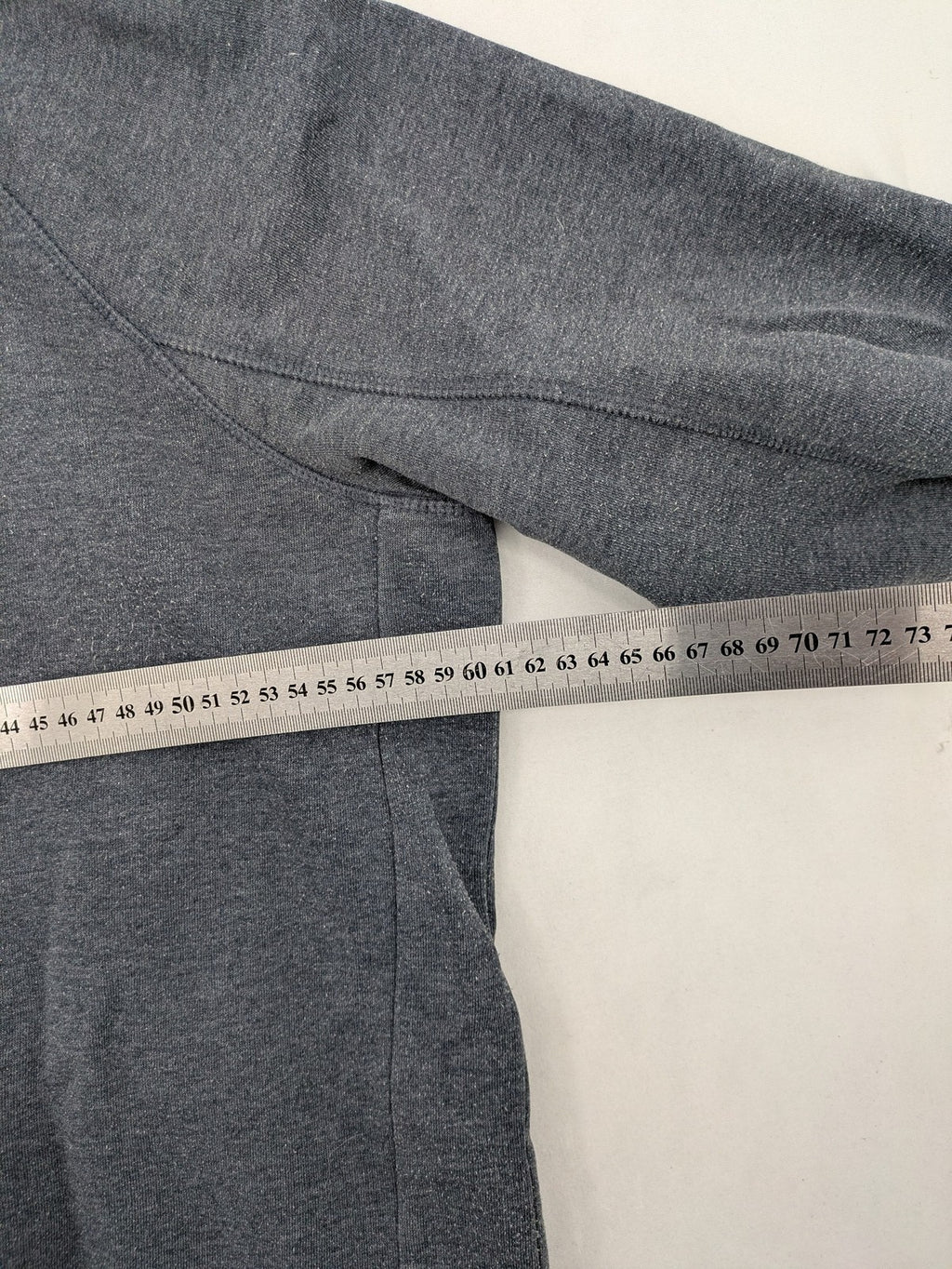 C&A grey hoodie with embossed chest logo, teddy-lined hood, and side zip pockets.