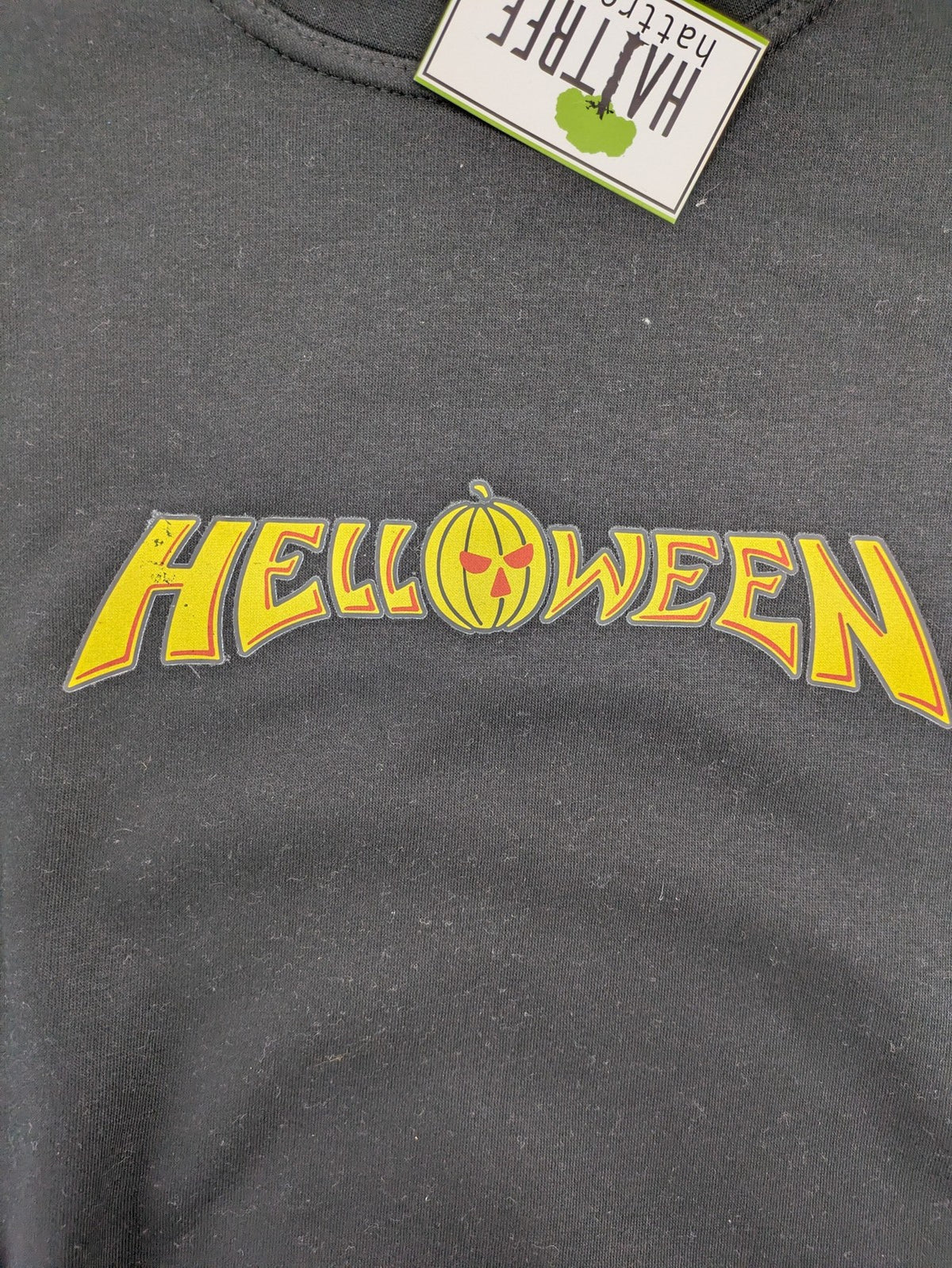 Helloween grey sweatshirt featuring bright yellow band logo, made from cotton blend.
