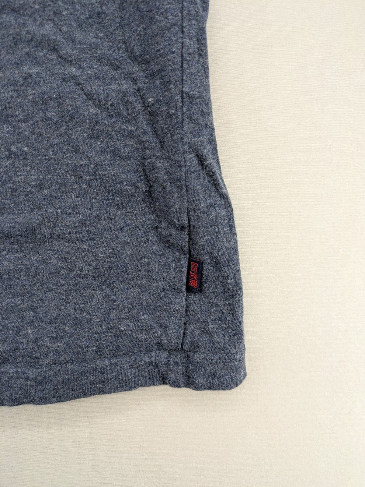Superdry grey long sleeve shirt melange with embroidered logo and red collar accent.