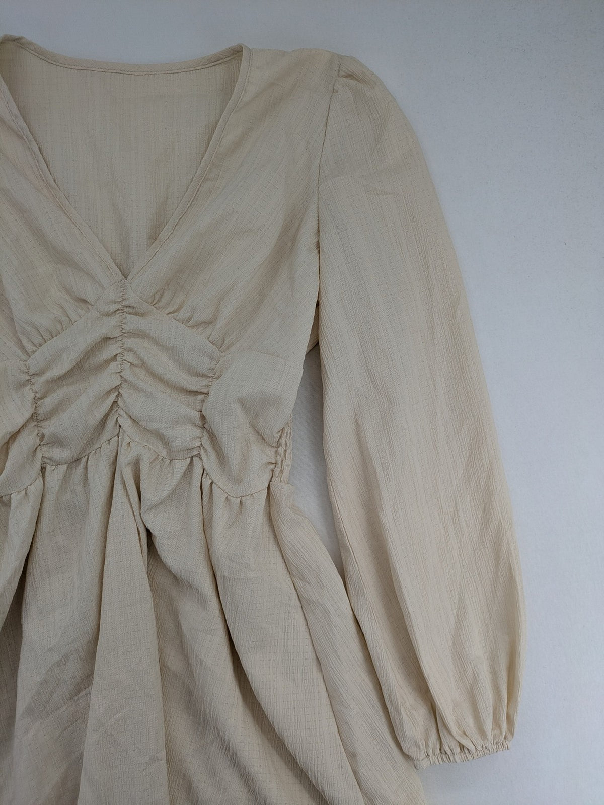 SHEIN beige bridal party dress with V-neck, ruffled bodice, and bishop sleeves.
