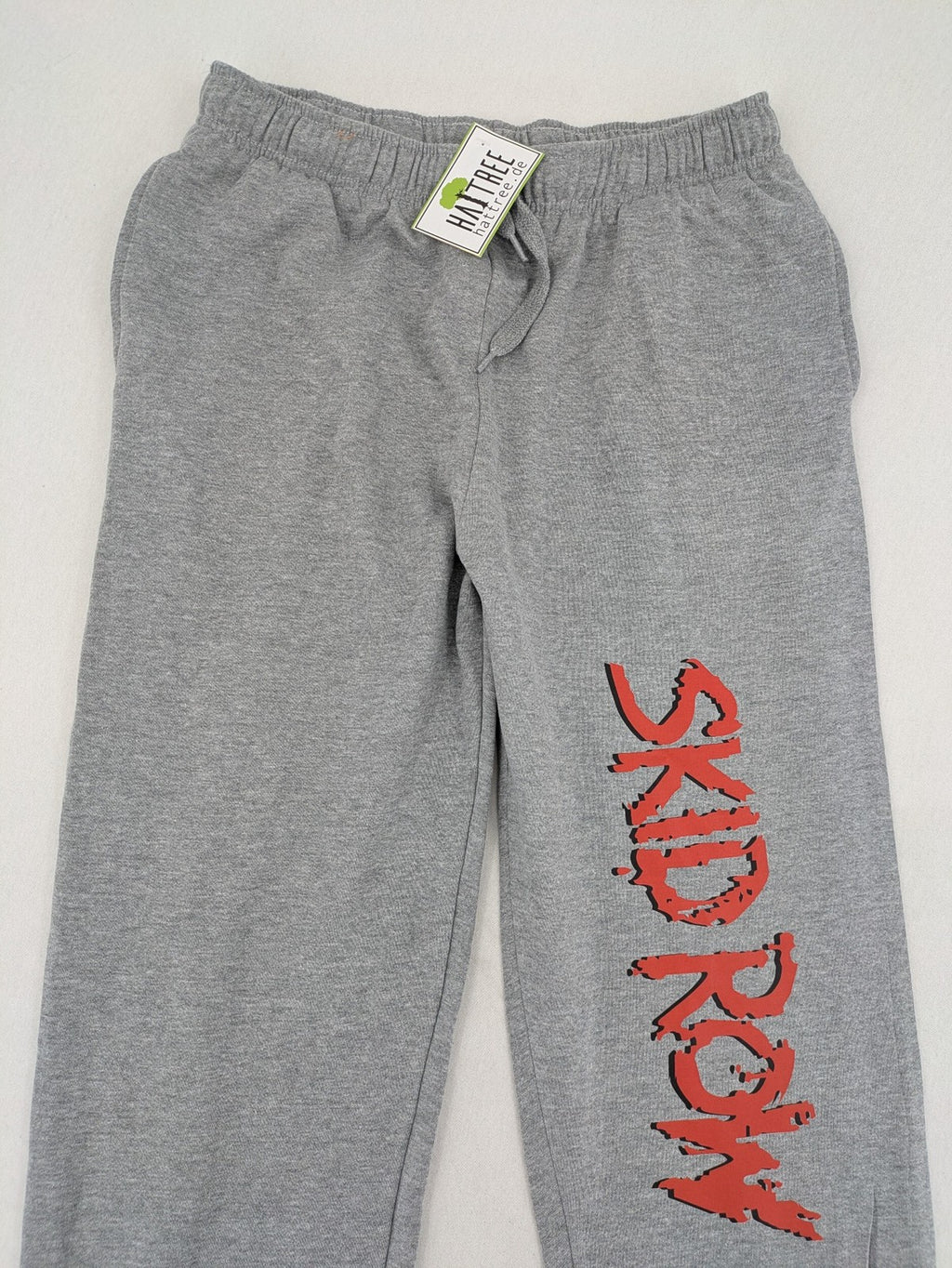 Skid Row grey joggers with red band logo, soft cotton blend, elastic waistband.