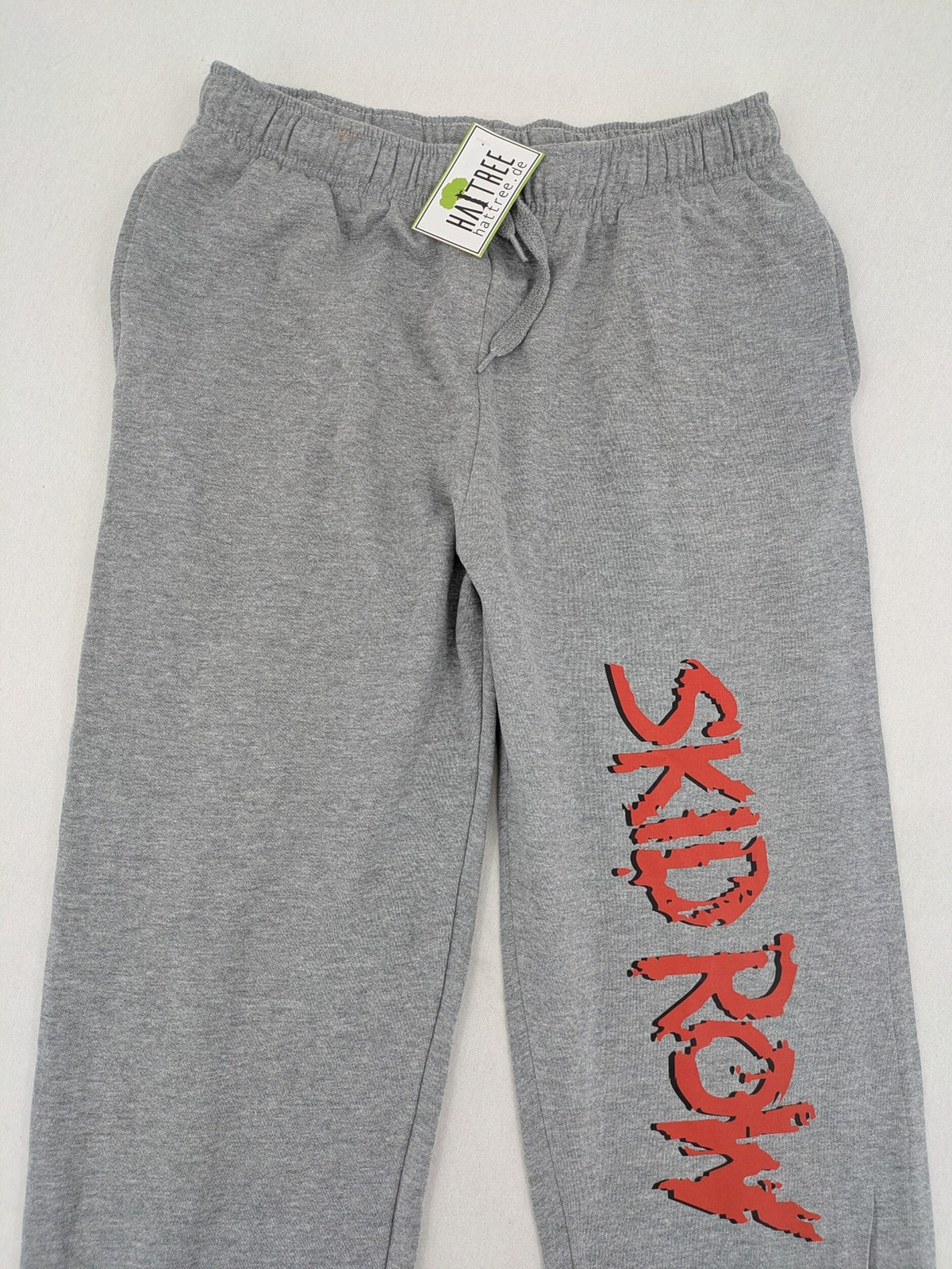 Skid Row grey joggers with red band logo, soft cotton blend, elastic waistband.