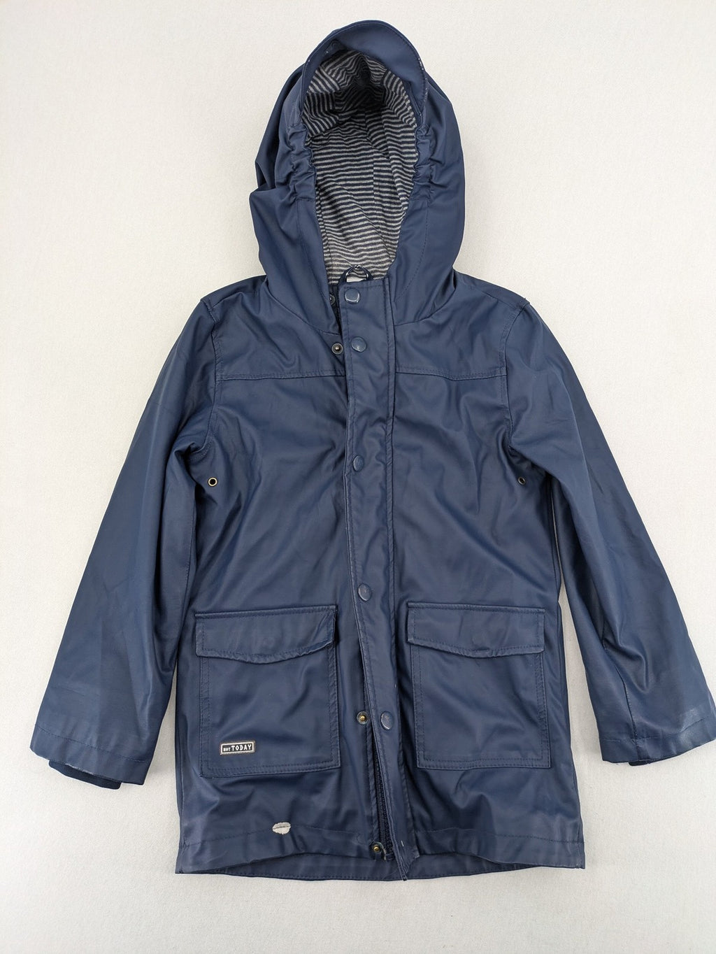 Pocopiano navy raincoat with striped lining and waterproof exterior, classic fisherman style.