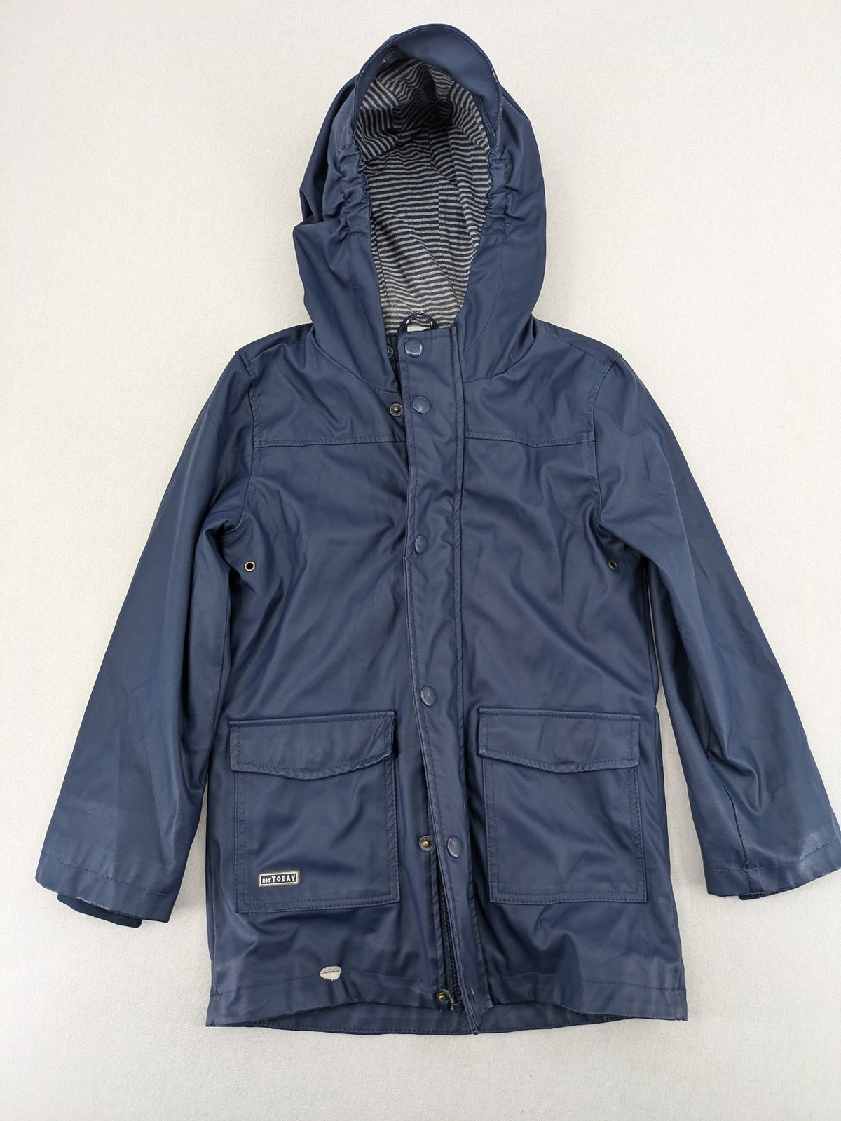 Pocopiano navy raincoat with striped lining and waterproof exterior, classic fisherman style.