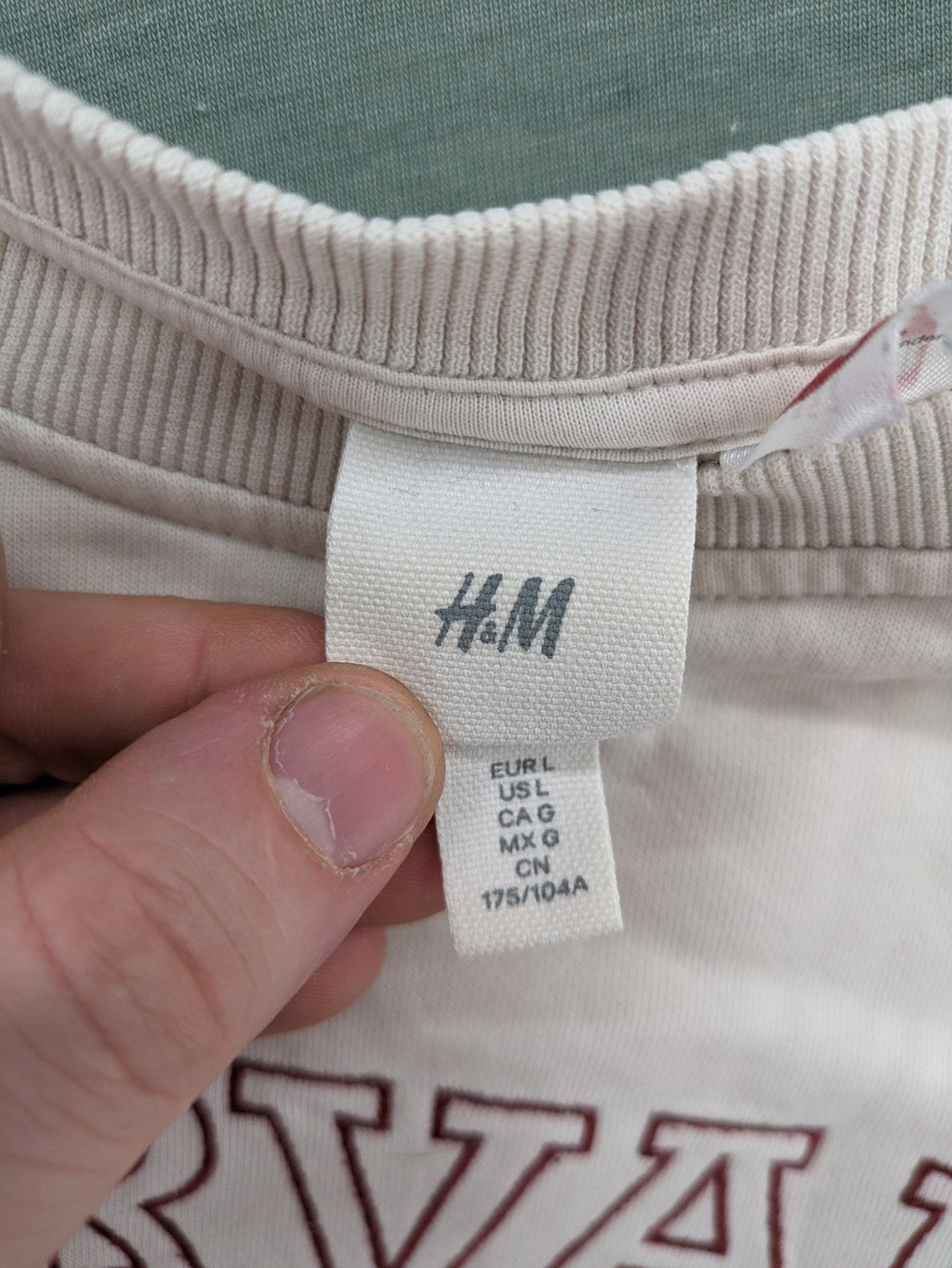 H&M cream turtle neck jumper embroidered Harvard University logo, soft cotton blend.