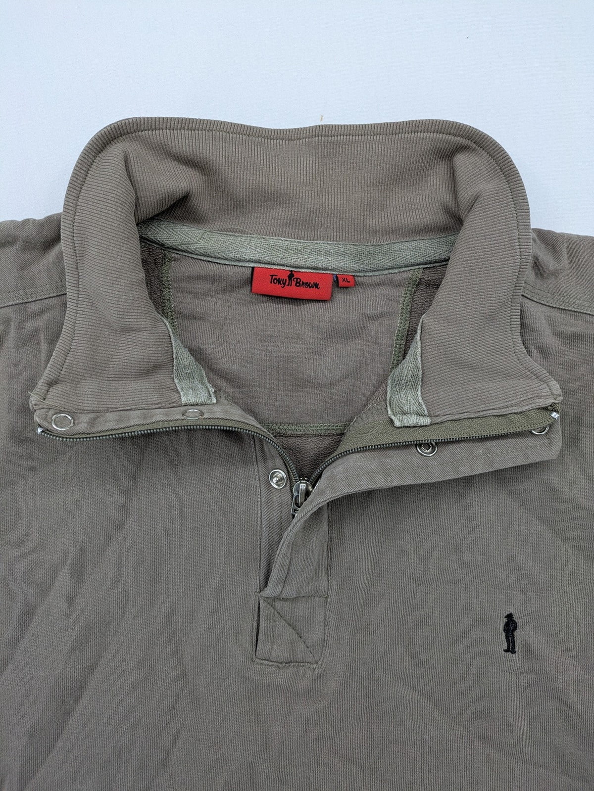 Tony Brown brown turtle neck jumper with embroidered logo and zip button placket.