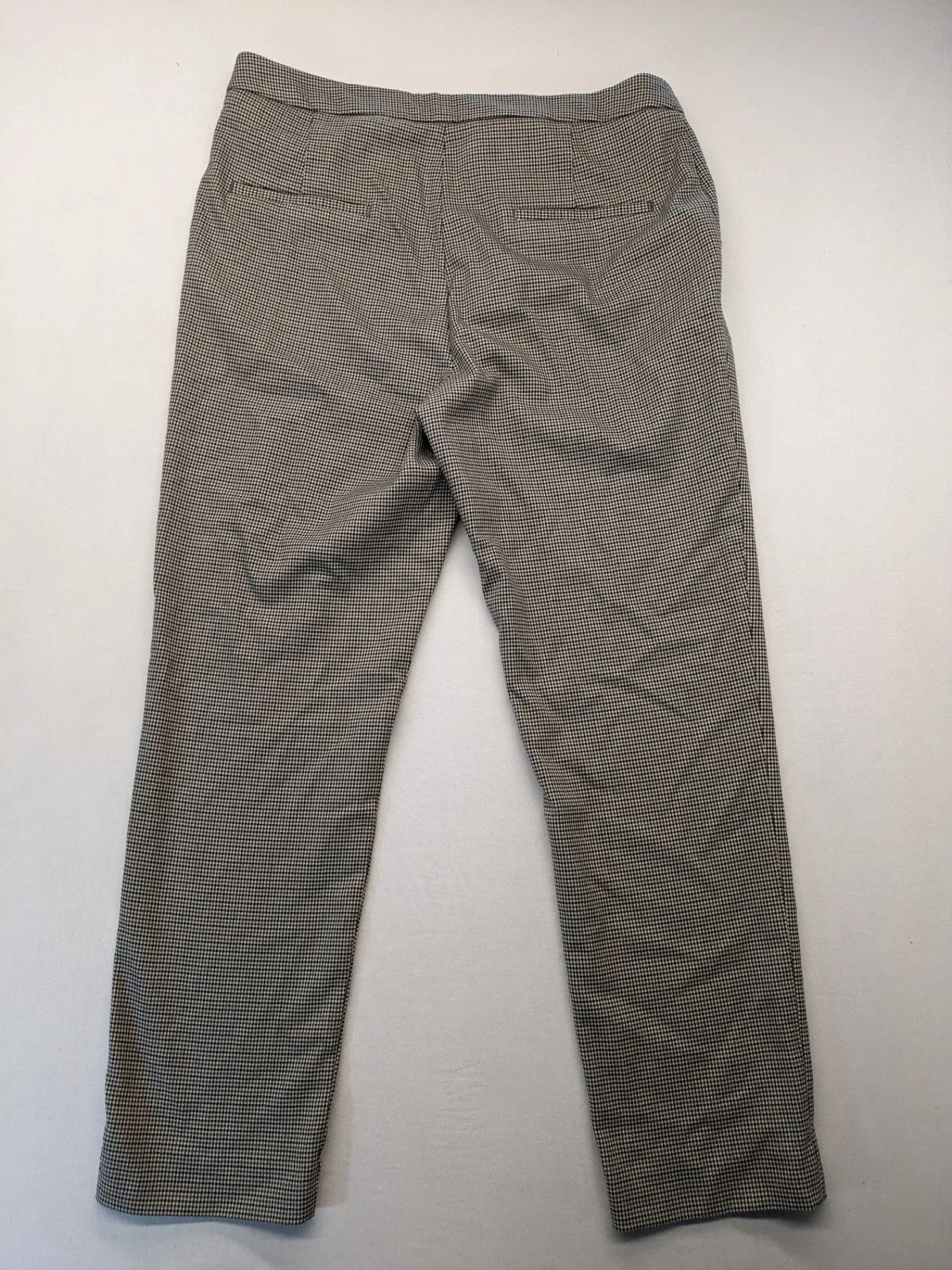 H&M beige pants houndstooth pattern with black and brown tones, stretchy material.