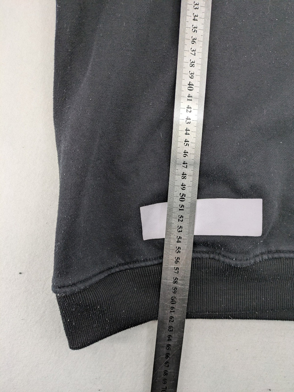 Off-White white zip-through hoodie with diagonal stripes and large arrows graphic.