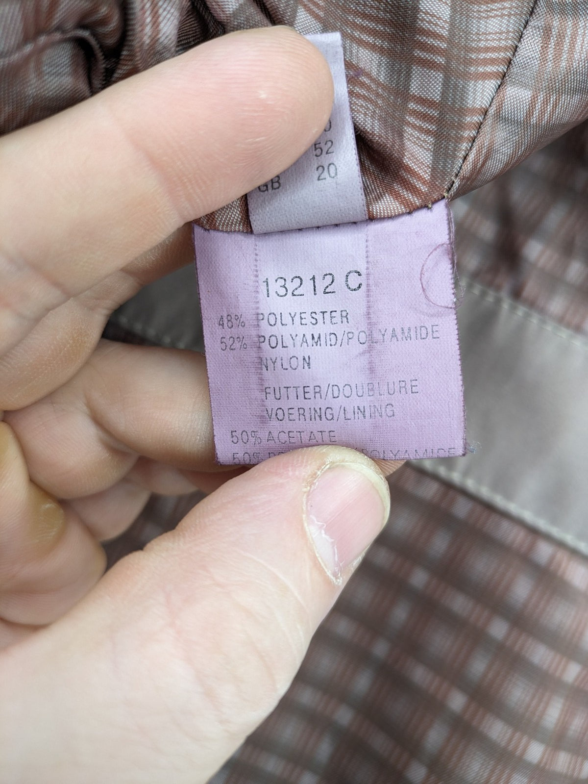 Goldix beige coat with checkered lining and Sympatex waterproof technology.