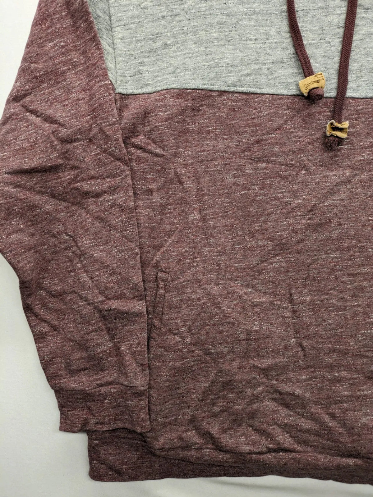 Bleed turtle neck jumper grey burgundy colorblock design with adjustable hood and kangaroo pocket.