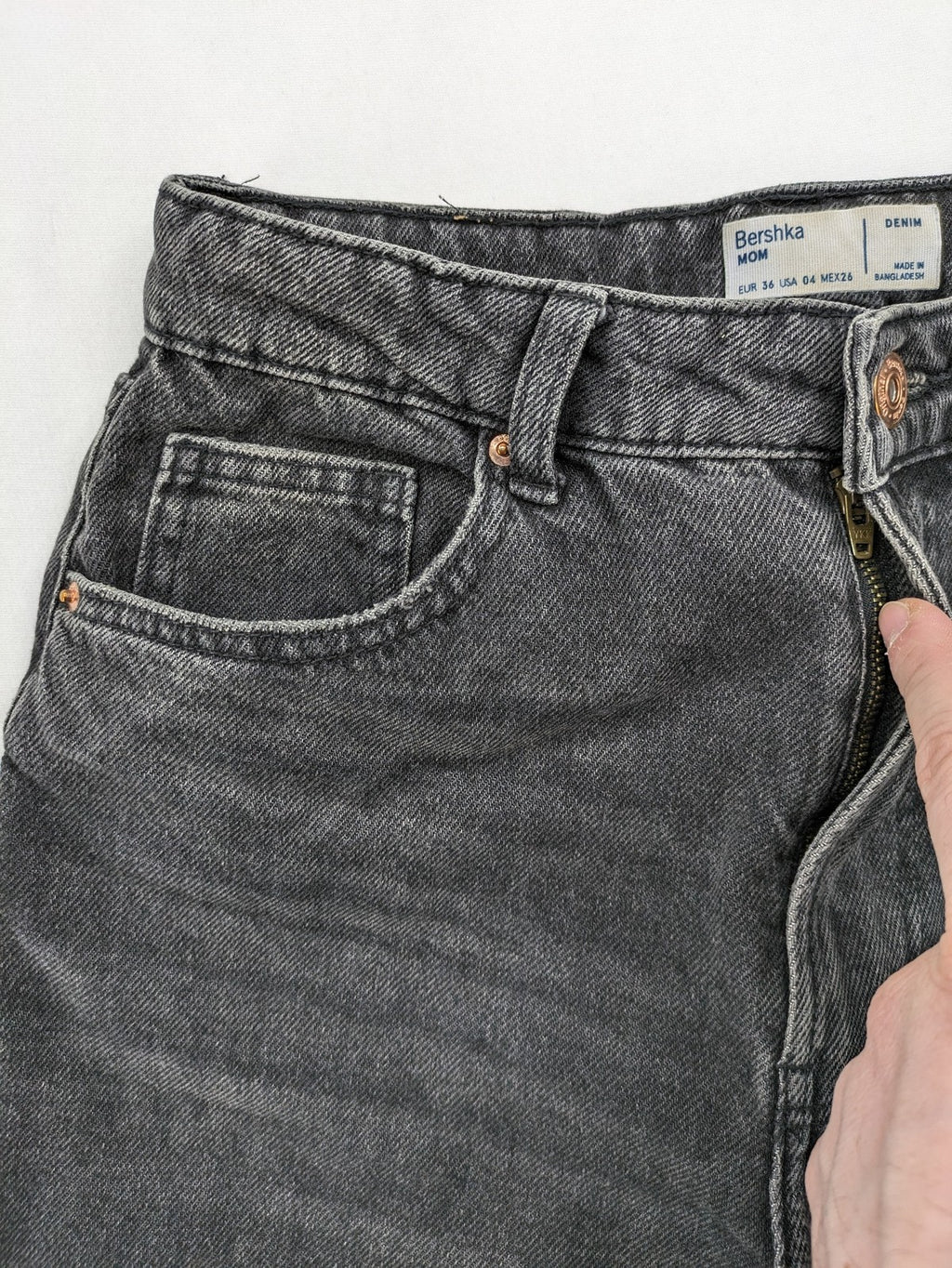 Bershka black mom jeans high-waist straight leg washed denim with classic five-pocket design.