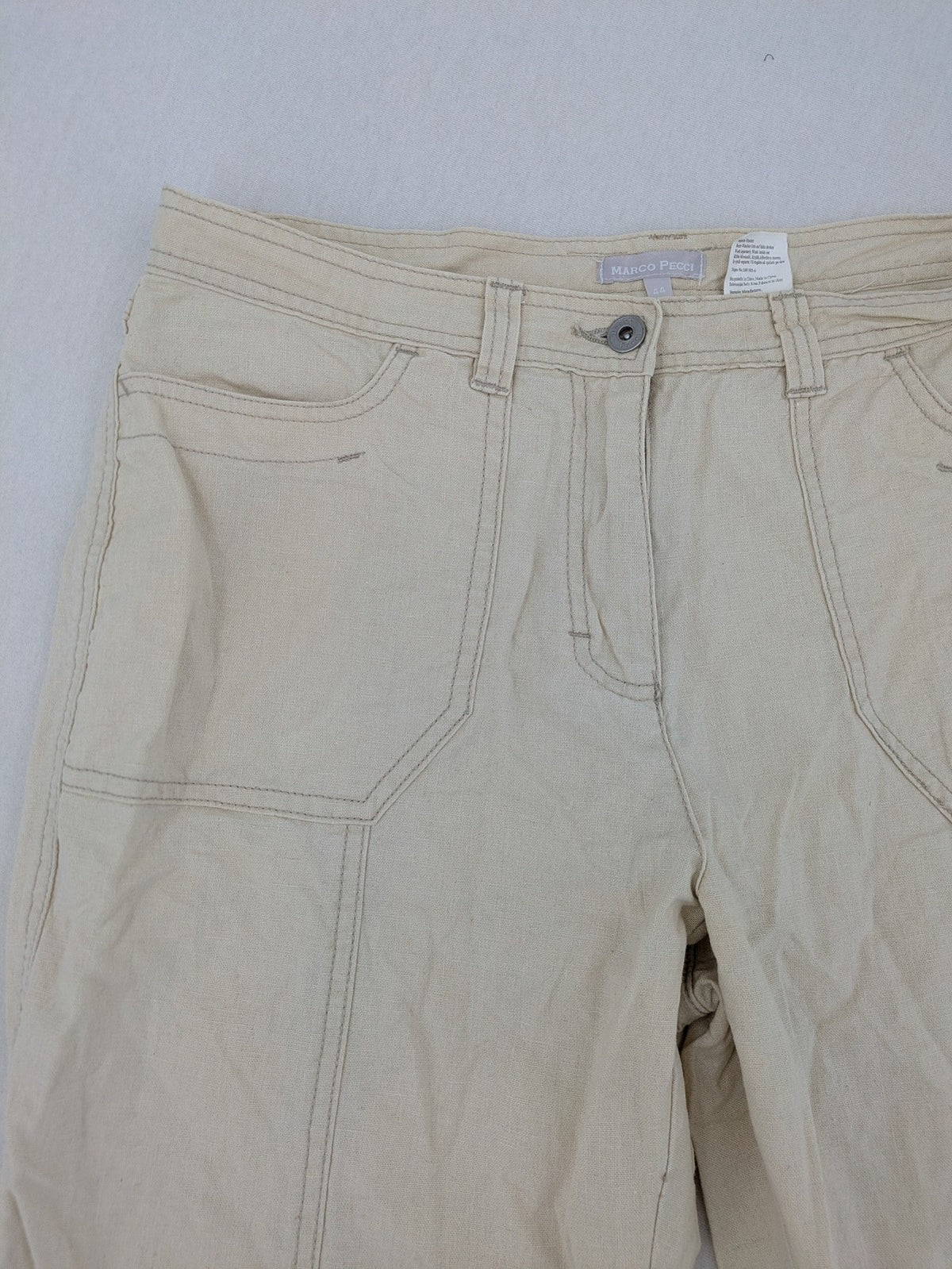 Marco Pecci beige capri pants with prominent seam details and practical pockets.