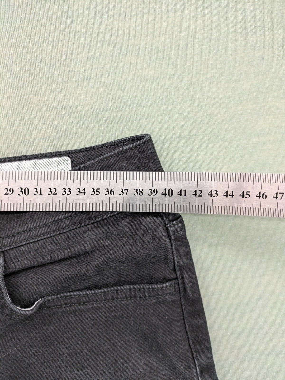 Denim & Co. grey slim fit jeans with button fly and classic 5-pocket design.