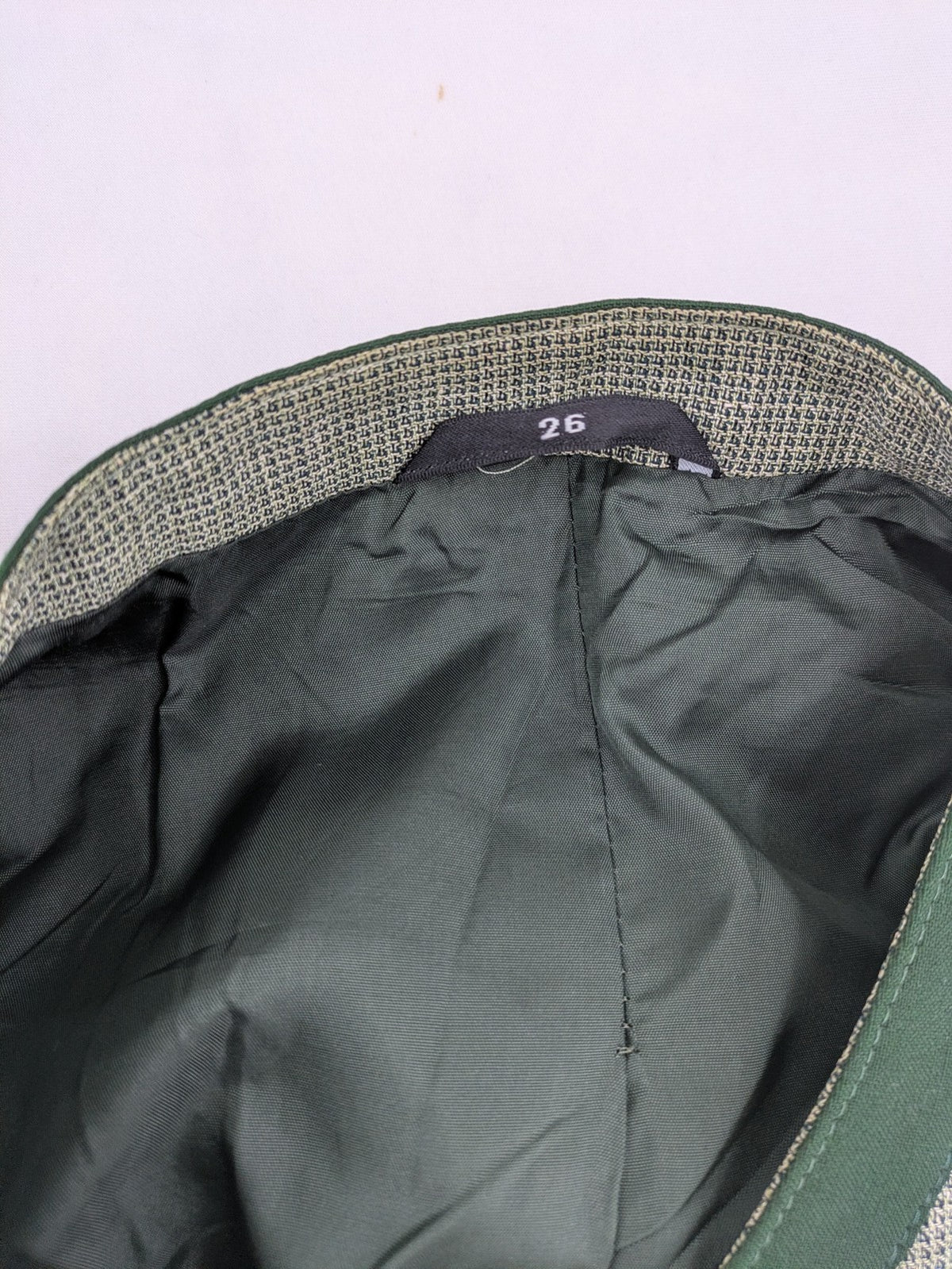 Traunsee Trachten green jacket with standing collar, decorative buttons, and premium wool-linen blend.